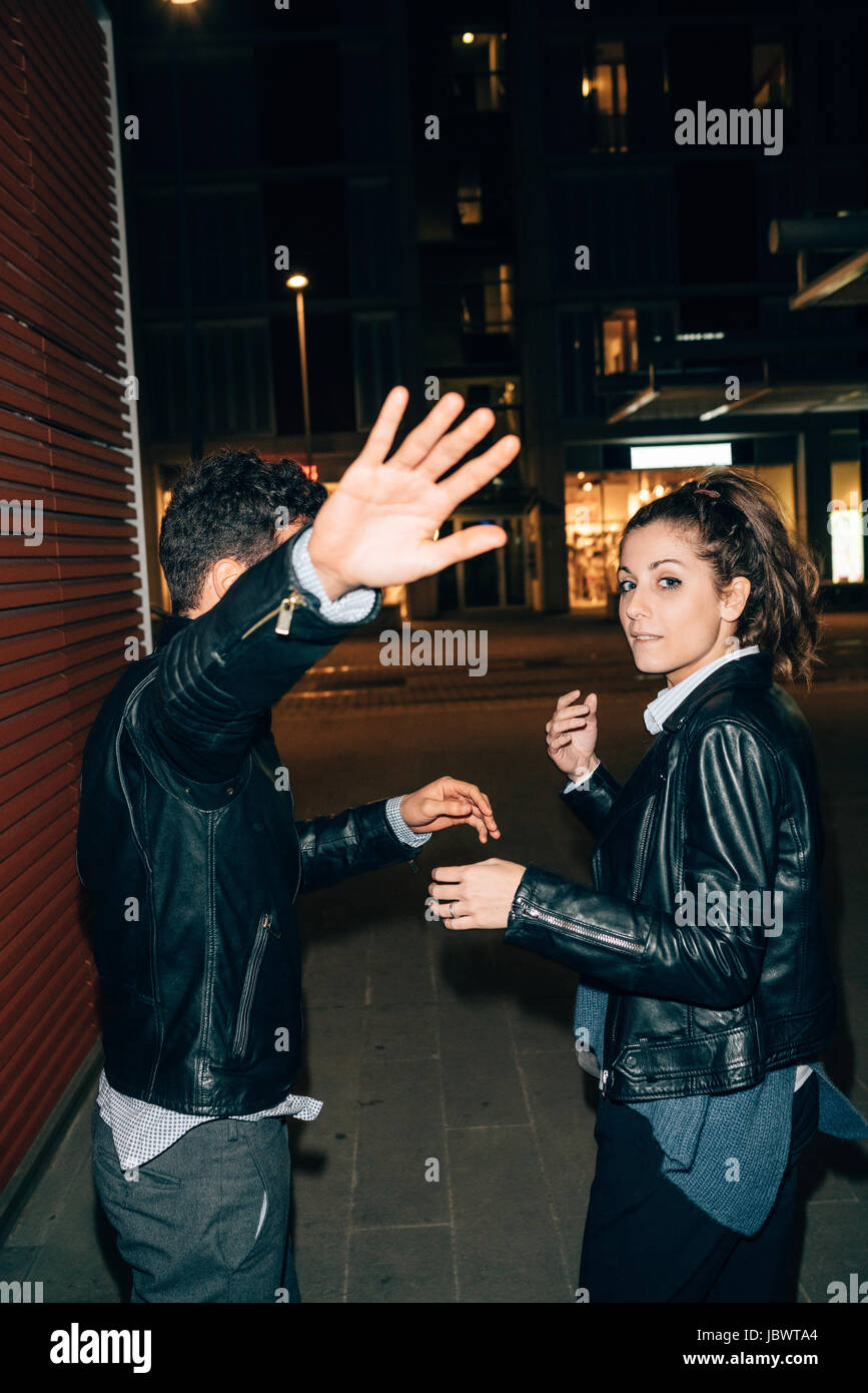 Couple avoiding paparazzi, Florence, Italy Stock Photo