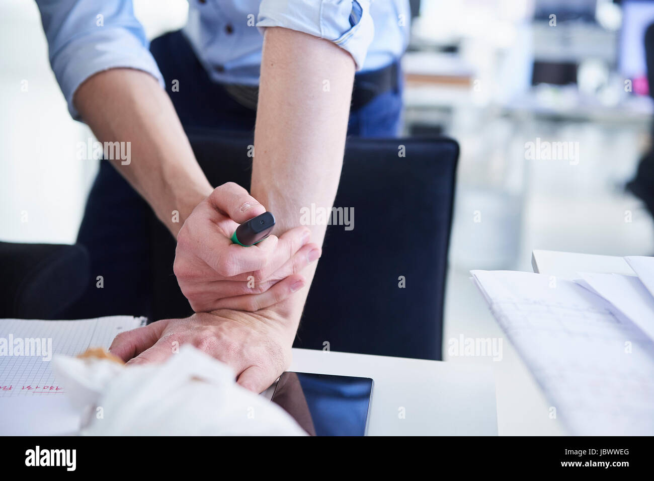 Cropped view of man in office holding highlighter pen Stock Photo