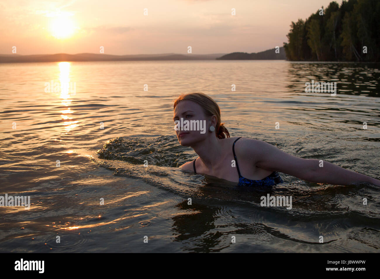 Woman swimming in sea, Nizny Tagil, Russia Stock Photo