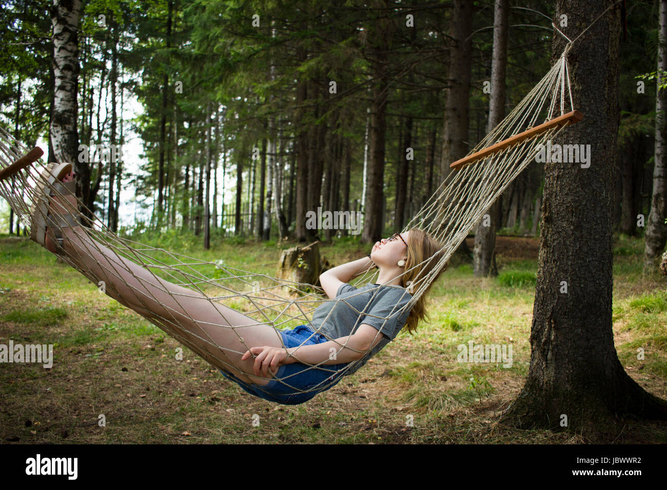 Woman resting in hammock, Nizny Tagil, Russia Stock Photo