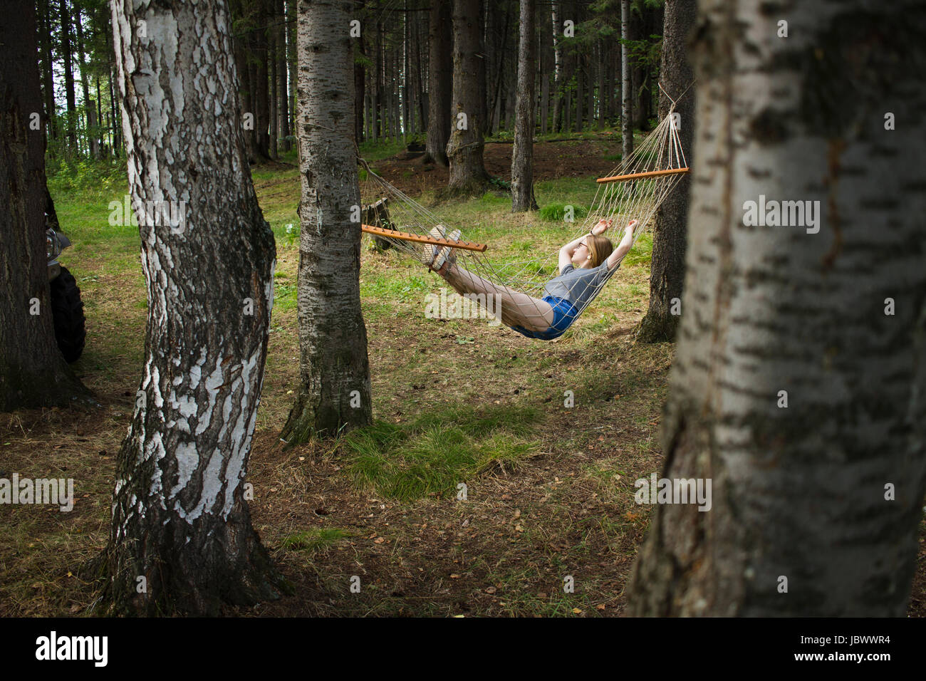 Woman resting in hammock, Nizny Tagil, Russia Stock Photo