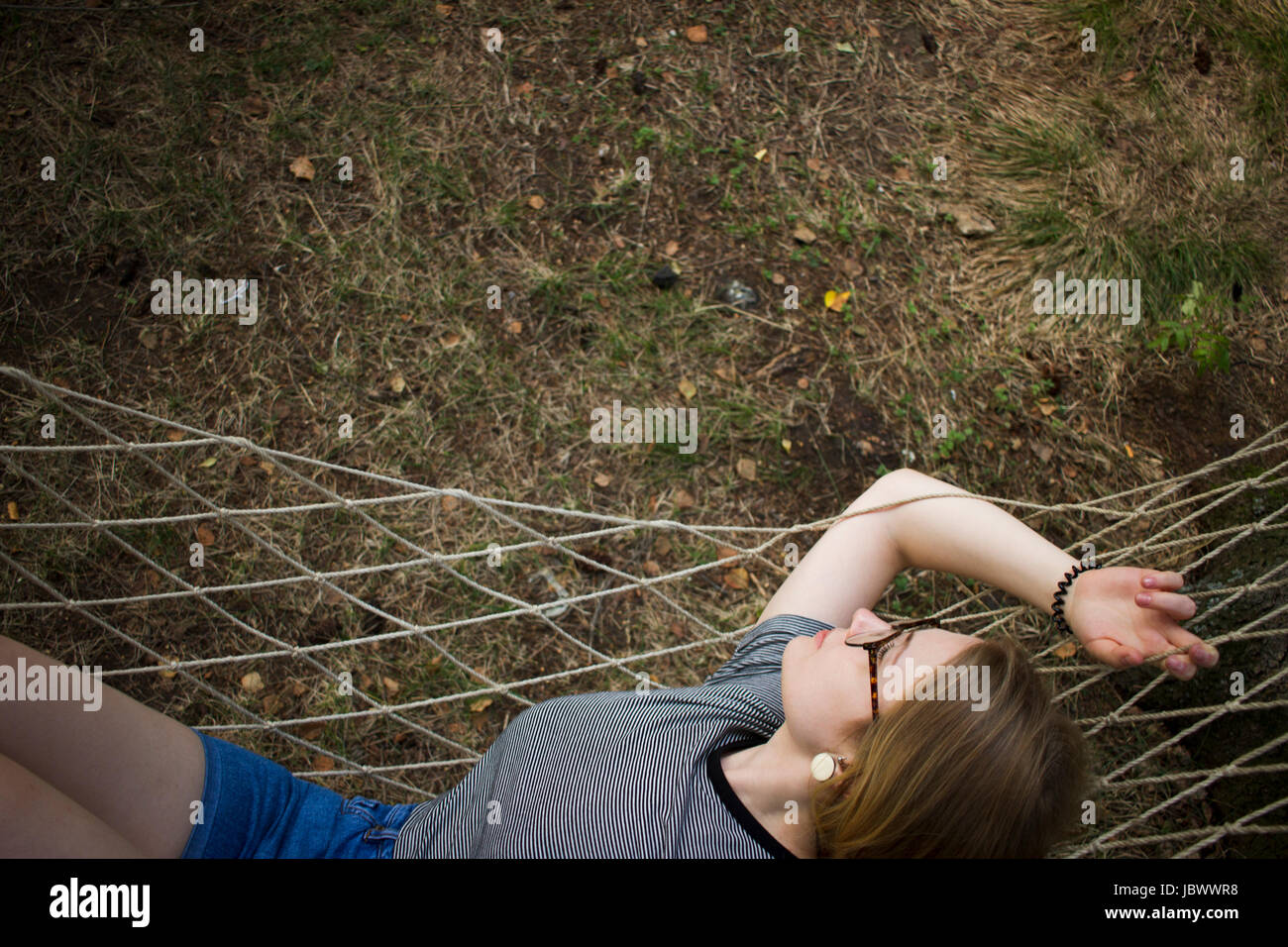 Woman resting in hammock Stock Photo