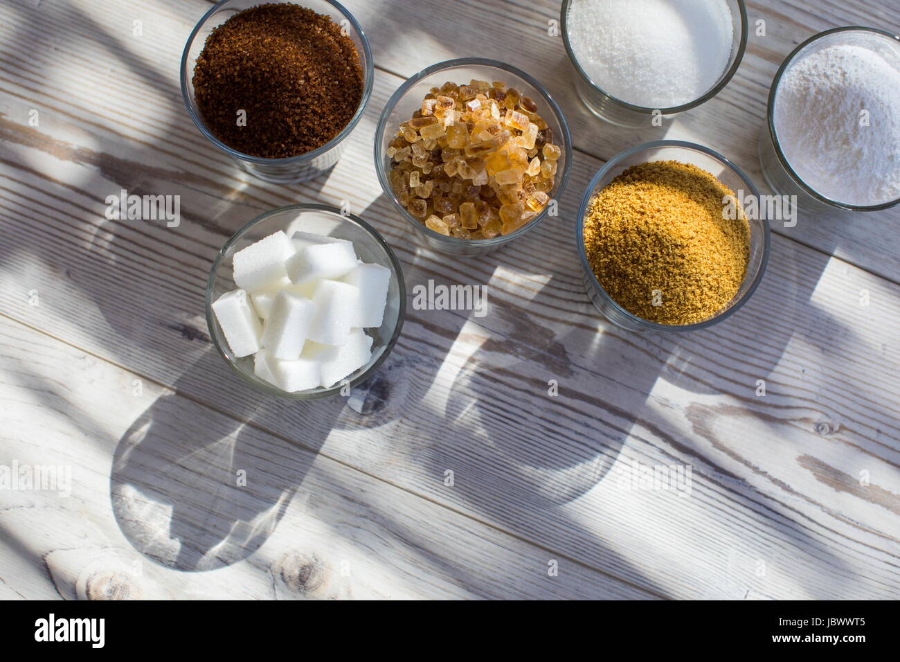 Glasses of sugar in various forms, overhead view Stock Photo Alamy