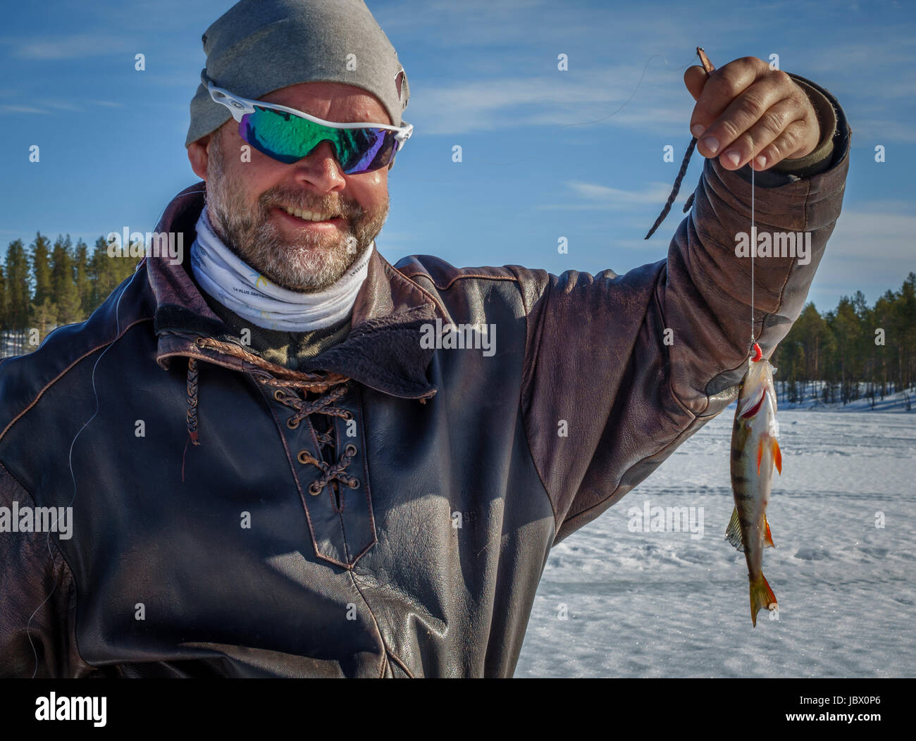 Ice fishing, Kangos, Lapland, Sweden Stock Photo