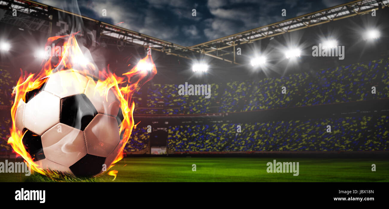 Burning soccer ball on stadium Stock Photo Alamy