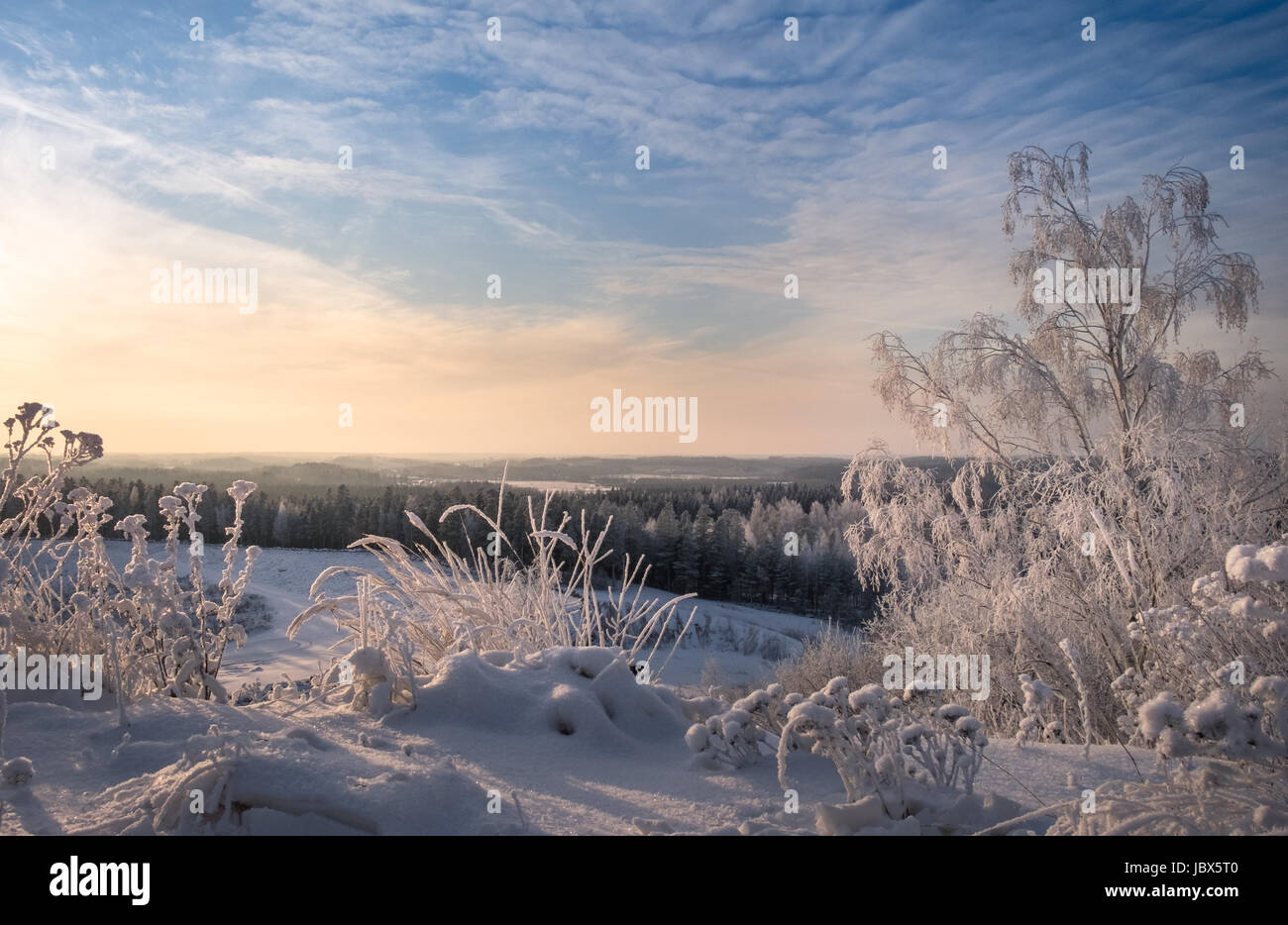 Scenic landscape with sunset at winter time in Finland Stock Photo