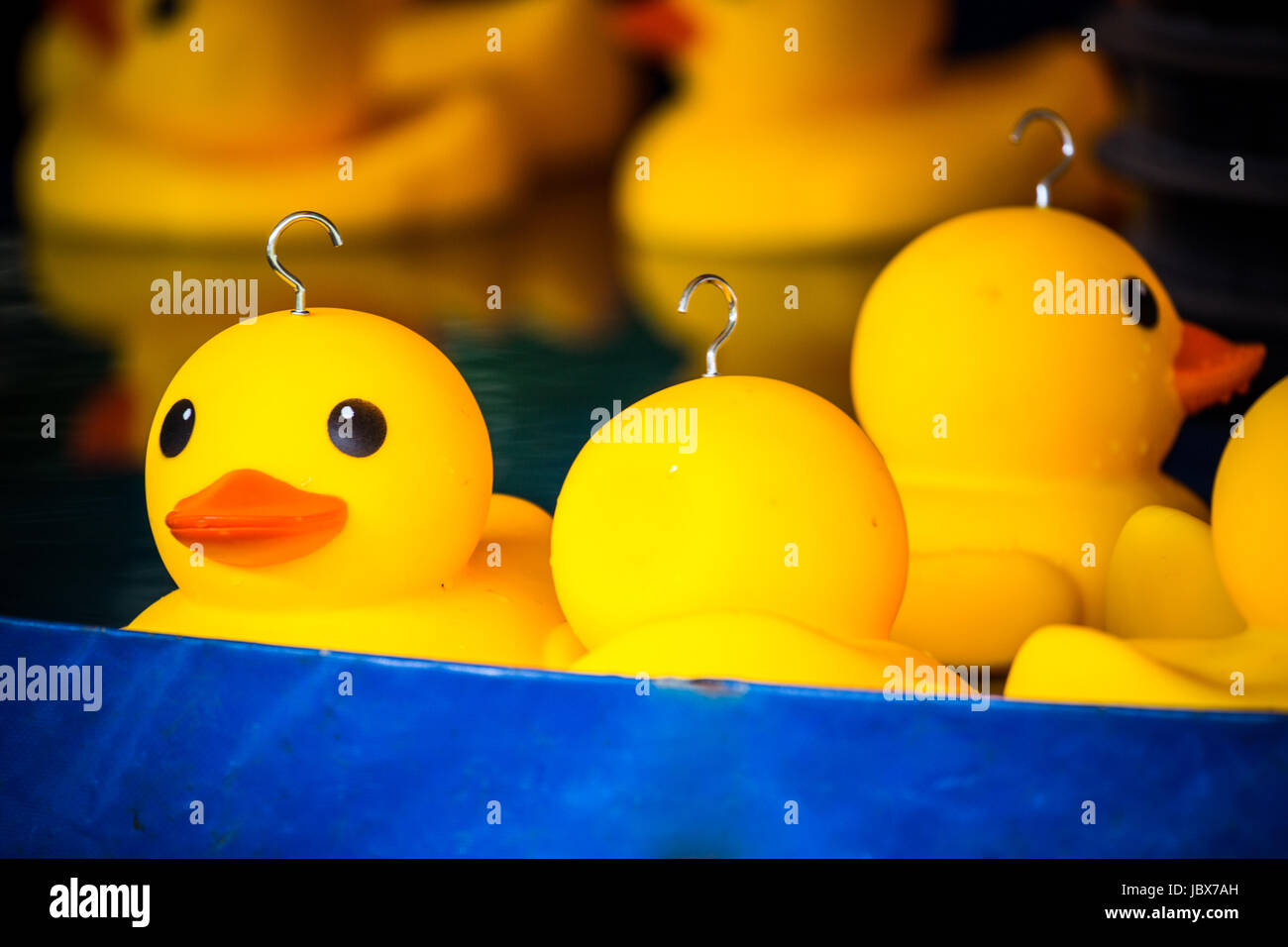https://c8.alamy.com/comp/JBX7AH/plastic-ducks-from-a-childrens-hook-a-duck-game-at-kirtlington-feast-JBX7AH.jpg