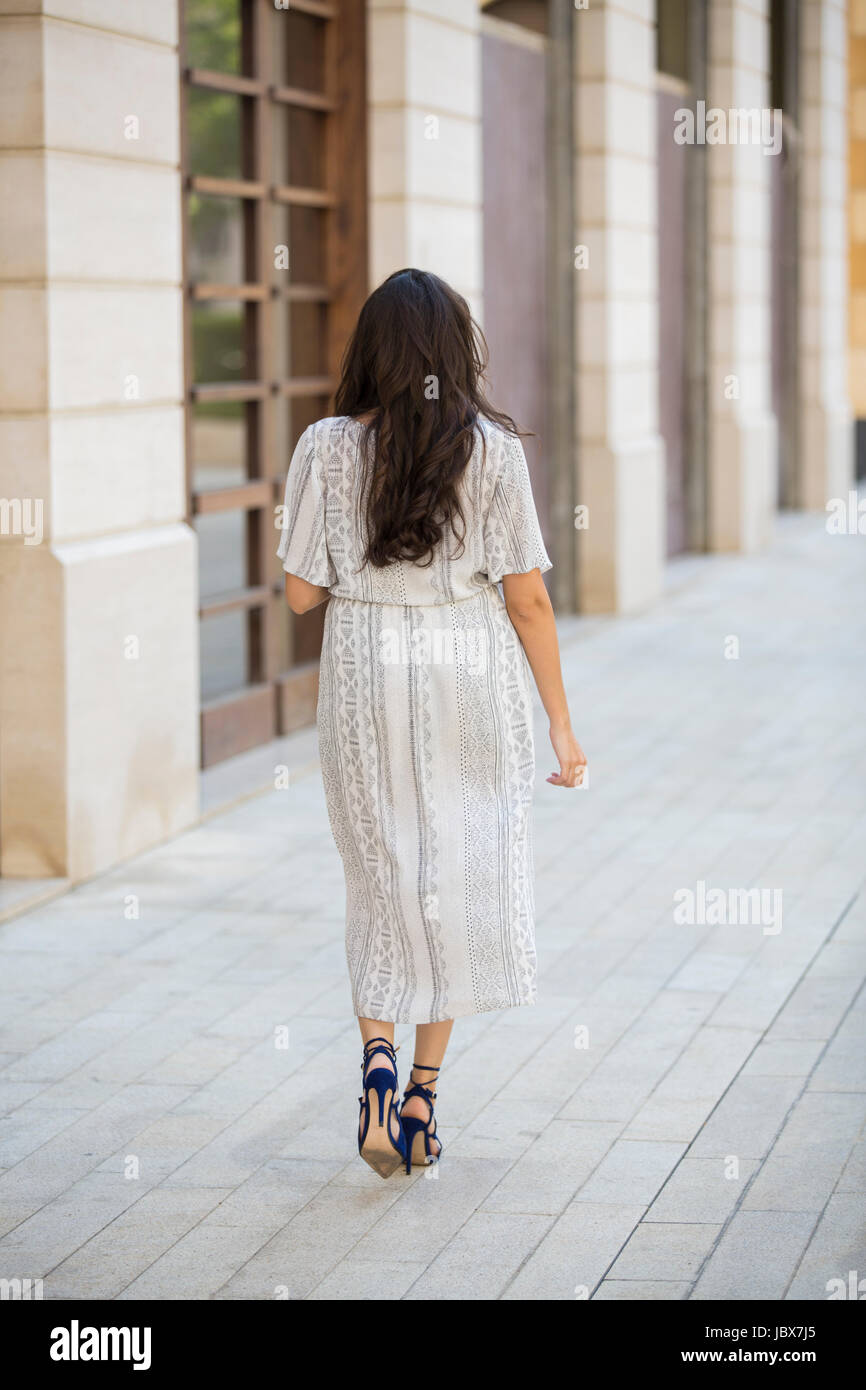 Asian woman walking rear view hi-res stock photography and images - Alamy