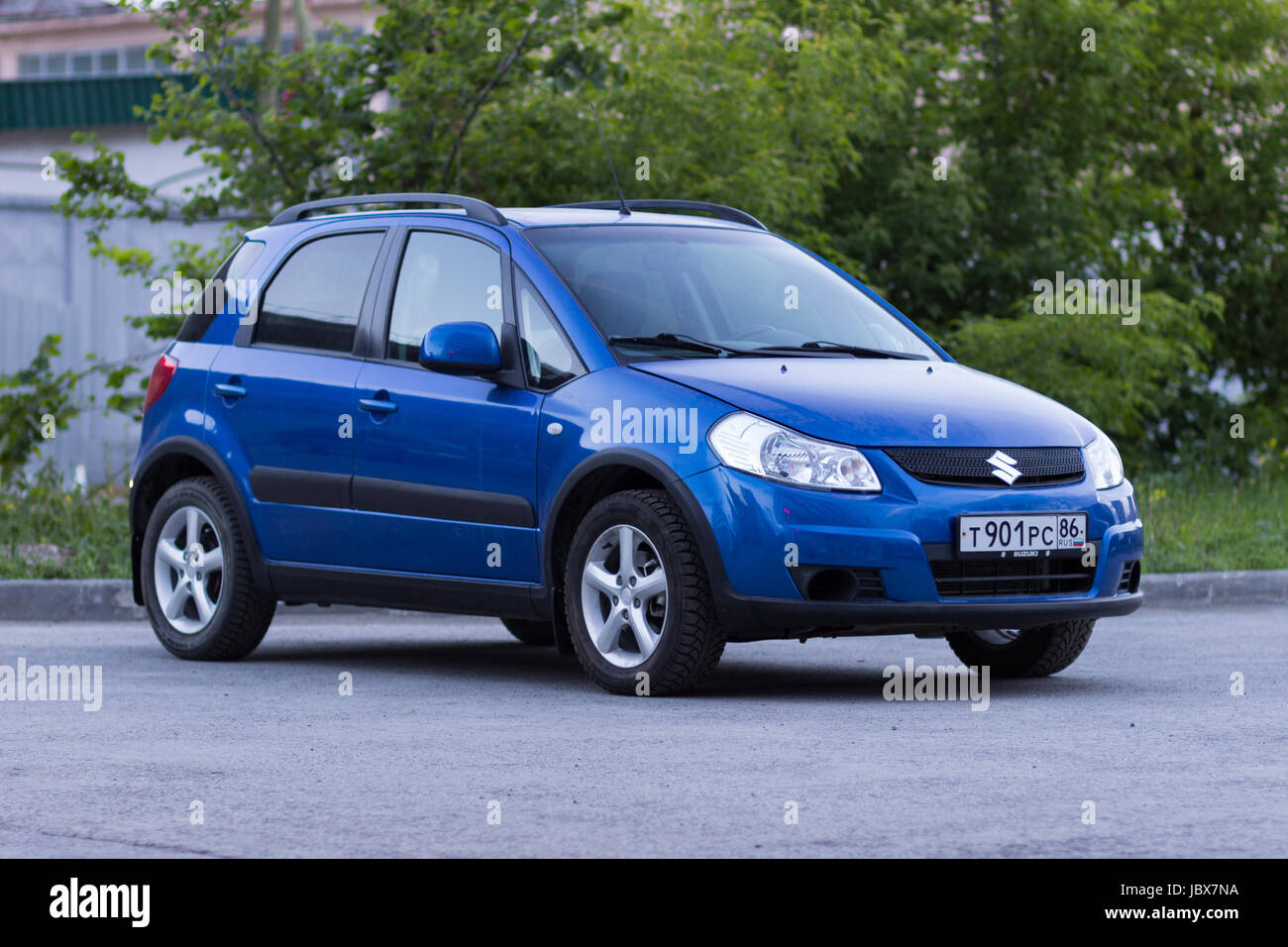 Ekaterinburg, Russia June 11, 2017 - Suzuki SX4 car of blue color stands on the asphalt parking lot in the evening Stock Photo