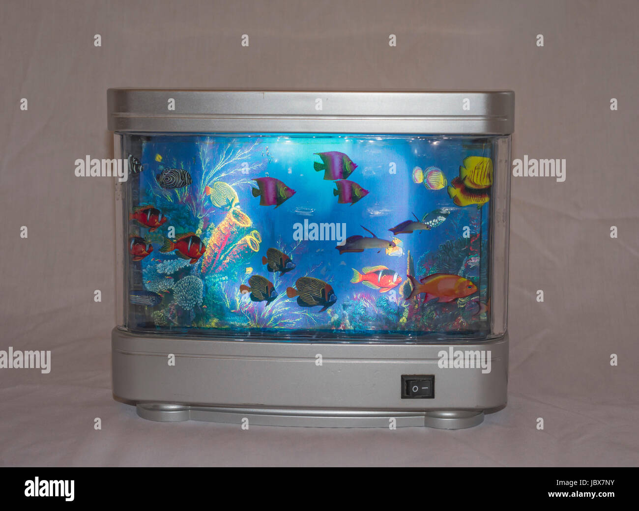Artificial Tropical Fish Aquarium Decorative Lamp with Multi Colored Artificial Fish and Ocean in Motion Stock Photo
