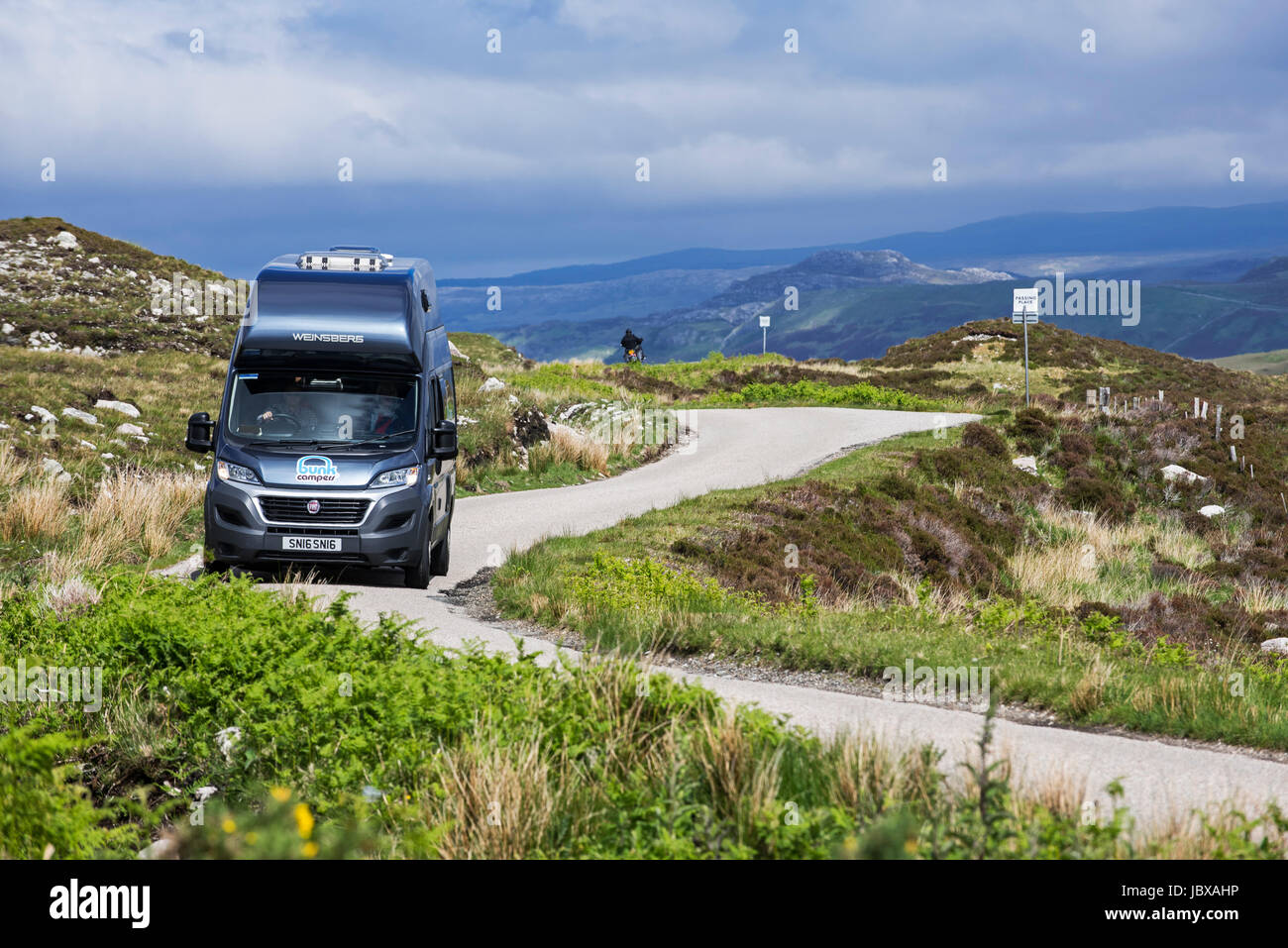 Motorhome at passing place on winding single track road in the Scottish Highlands, Scotland, UK Stock Photo