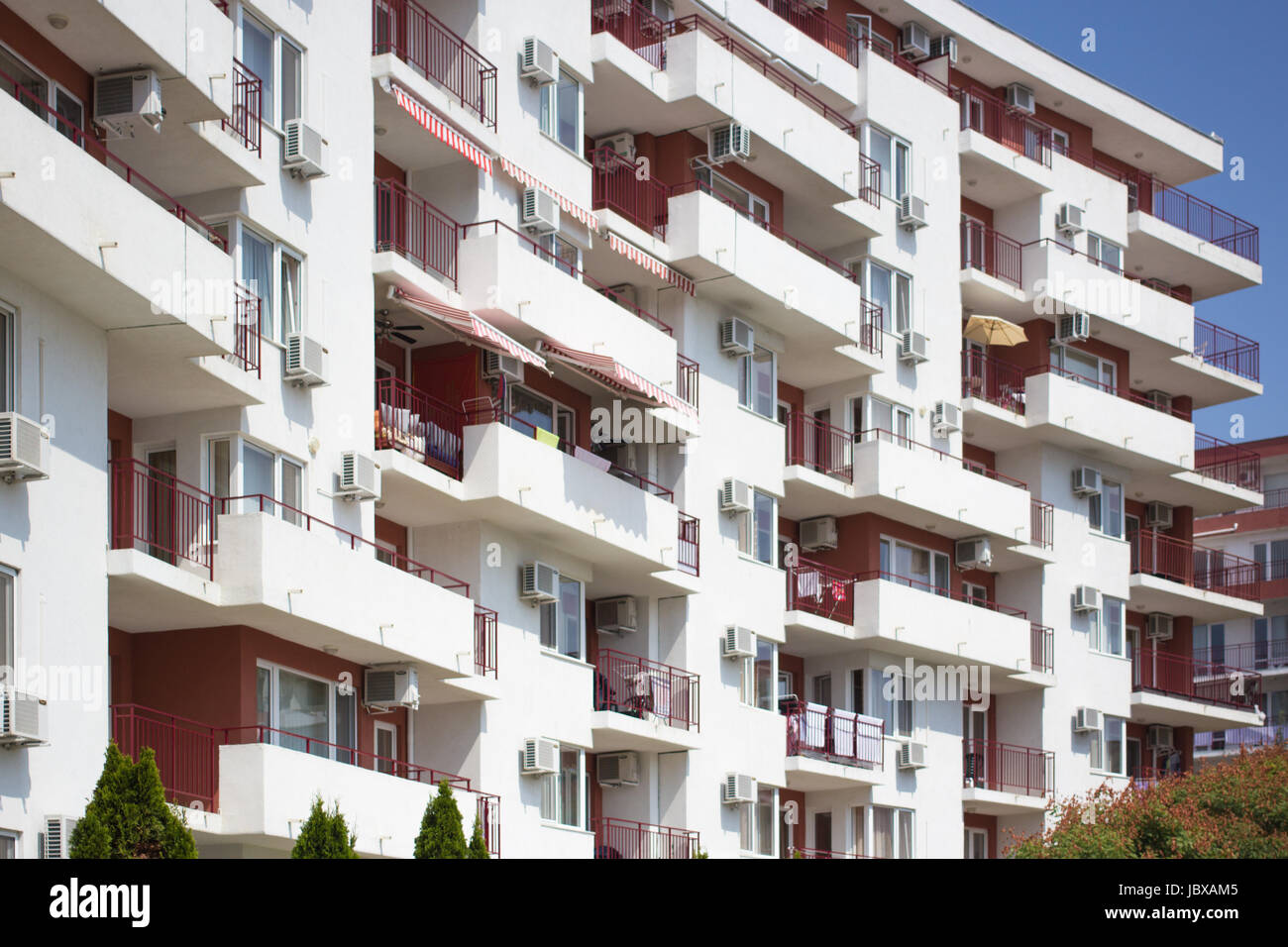 facade of a new modern apartment house with white balconies Stock Photo ...