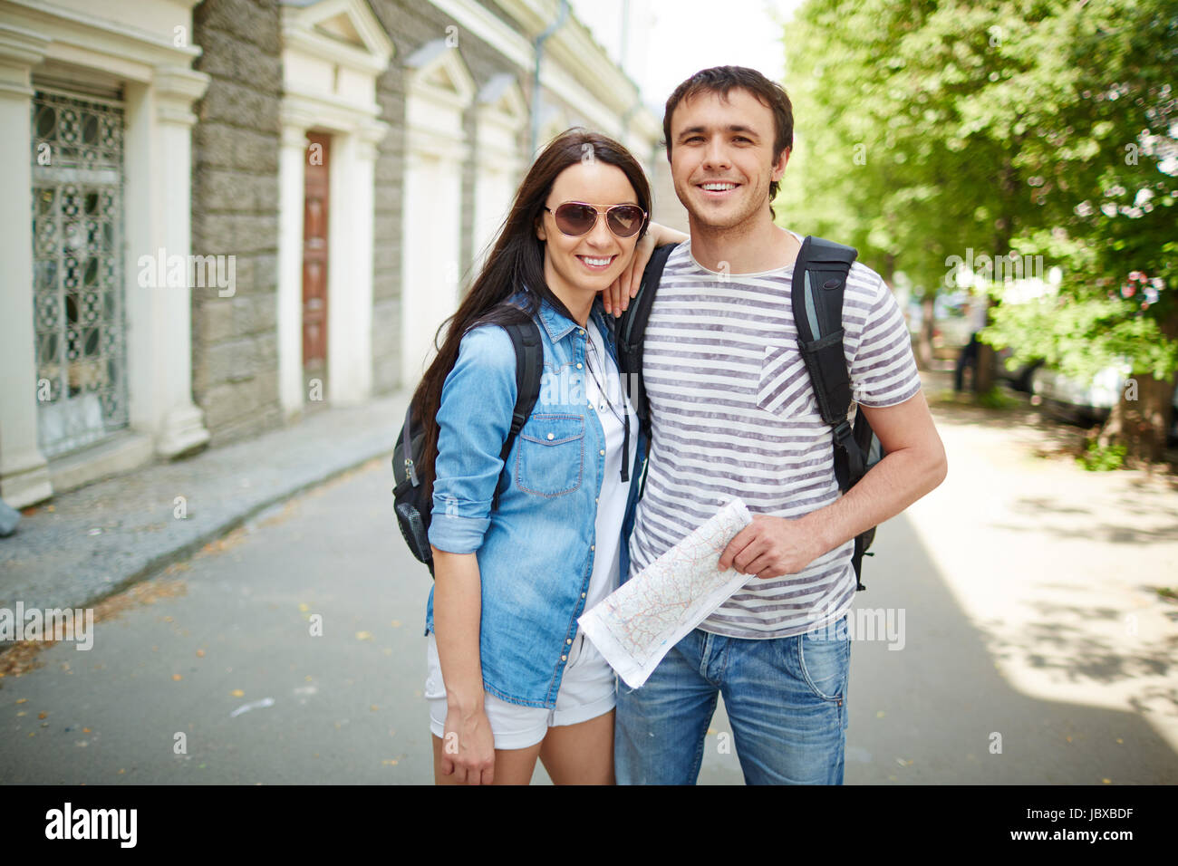 Portrait of young travelers looking at camera during journey Stock ...