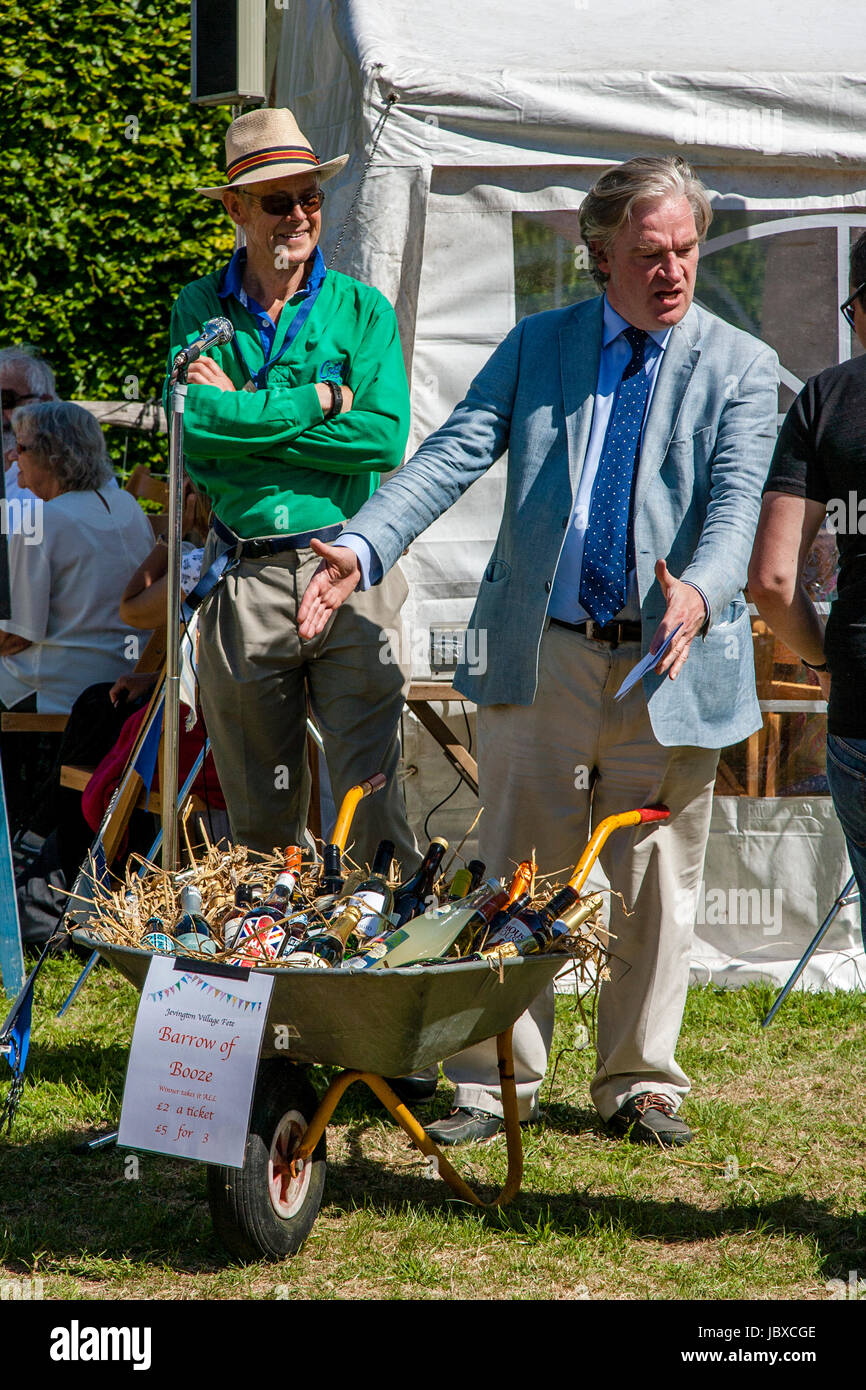 A Fete Compere Asks People To Enter A Raffle To Win A 'Barrow Of Booze' At The Jevington Fete
