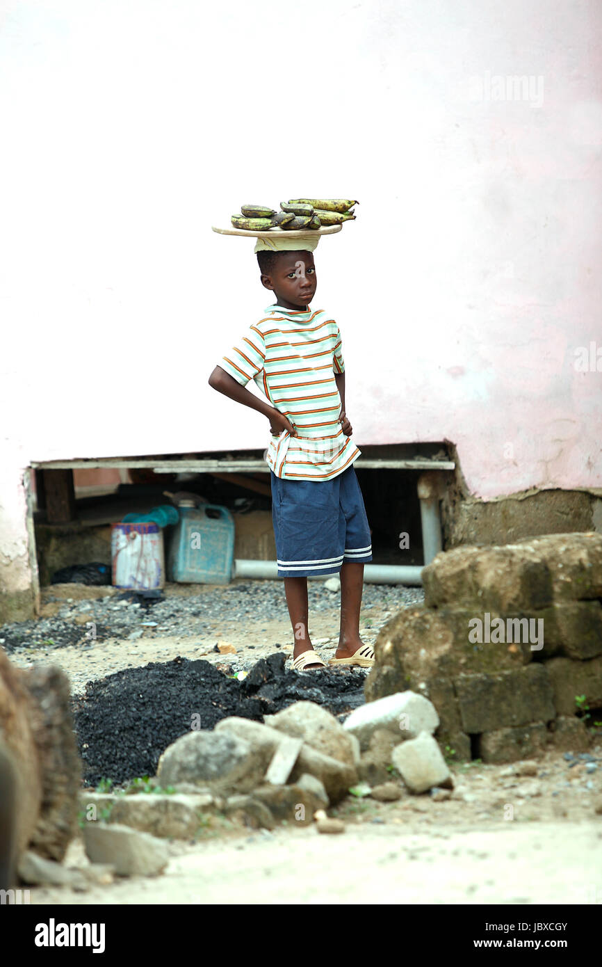 Portrait of an african boy wearing bananas on his head Stock Photo Alamy