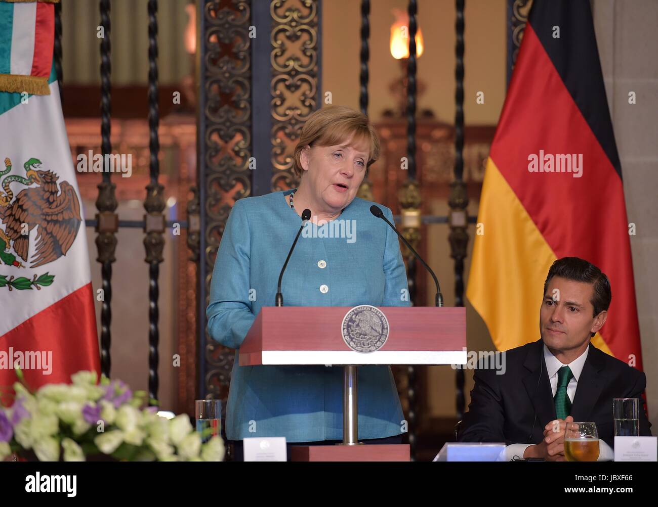 German Chancellor Angela Merkel speaks during reception hosted by Mexican President Enrique Pena Nieto, right, at the National Palace of Los Pinos June 9, 2017 in Mexico City, Mexico. Stock Photo