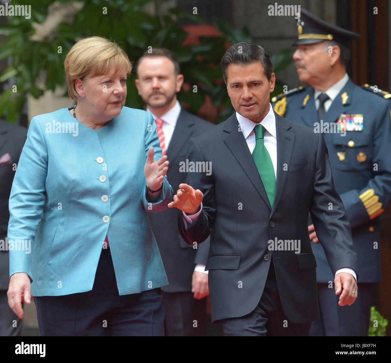 Mexican President Enrique Pena Nieto escorts German Chancellor Angela Merkel following the arrival ceremony at the National Palace at Los Pinos June 9, 2017 in Mexico City, Mexico. Stock Photo