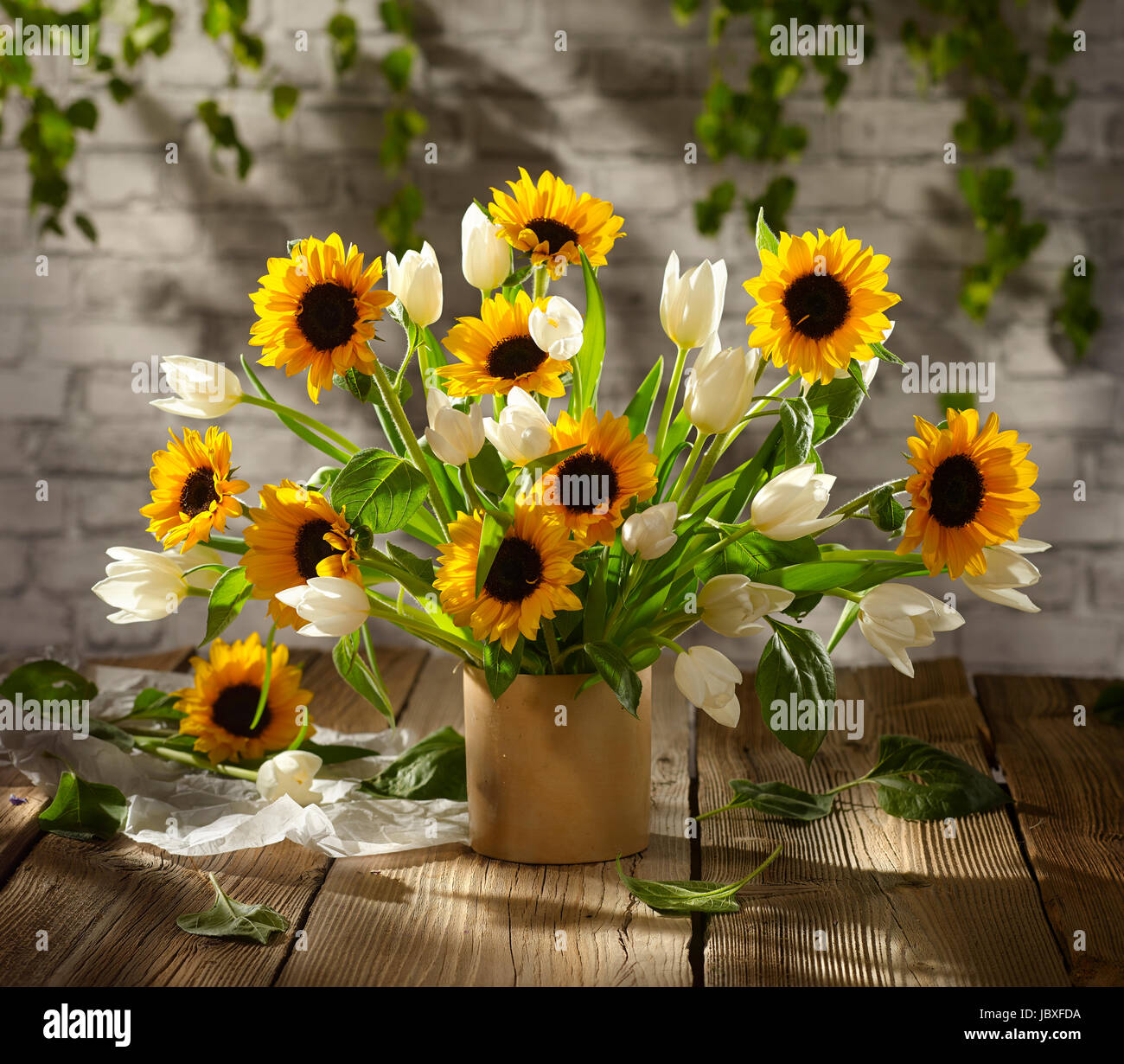 Bouquet of flowers with sunflowers and tulips. Stock Photo