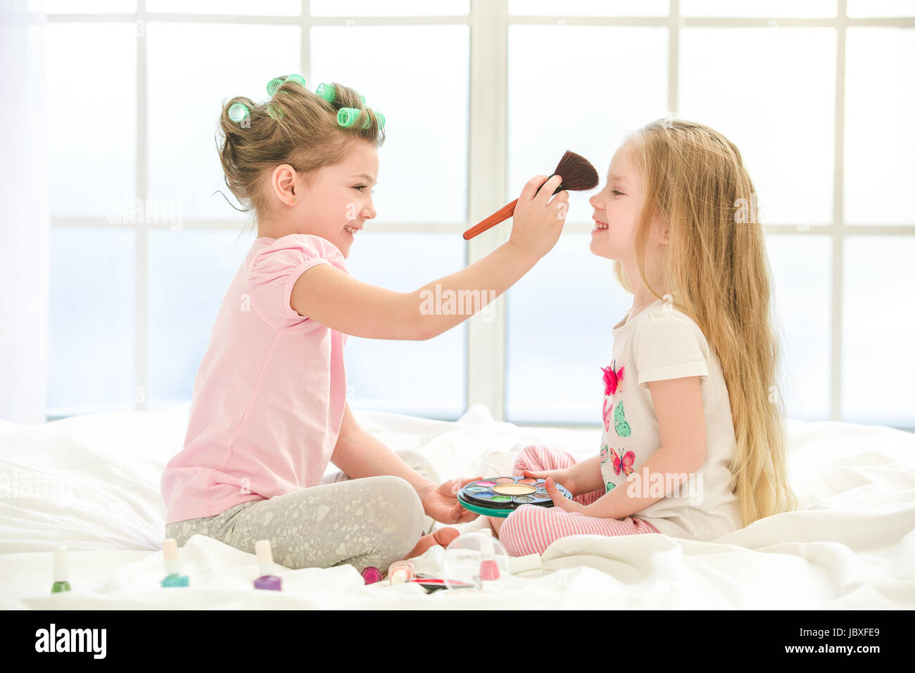 little girls playing with makeup