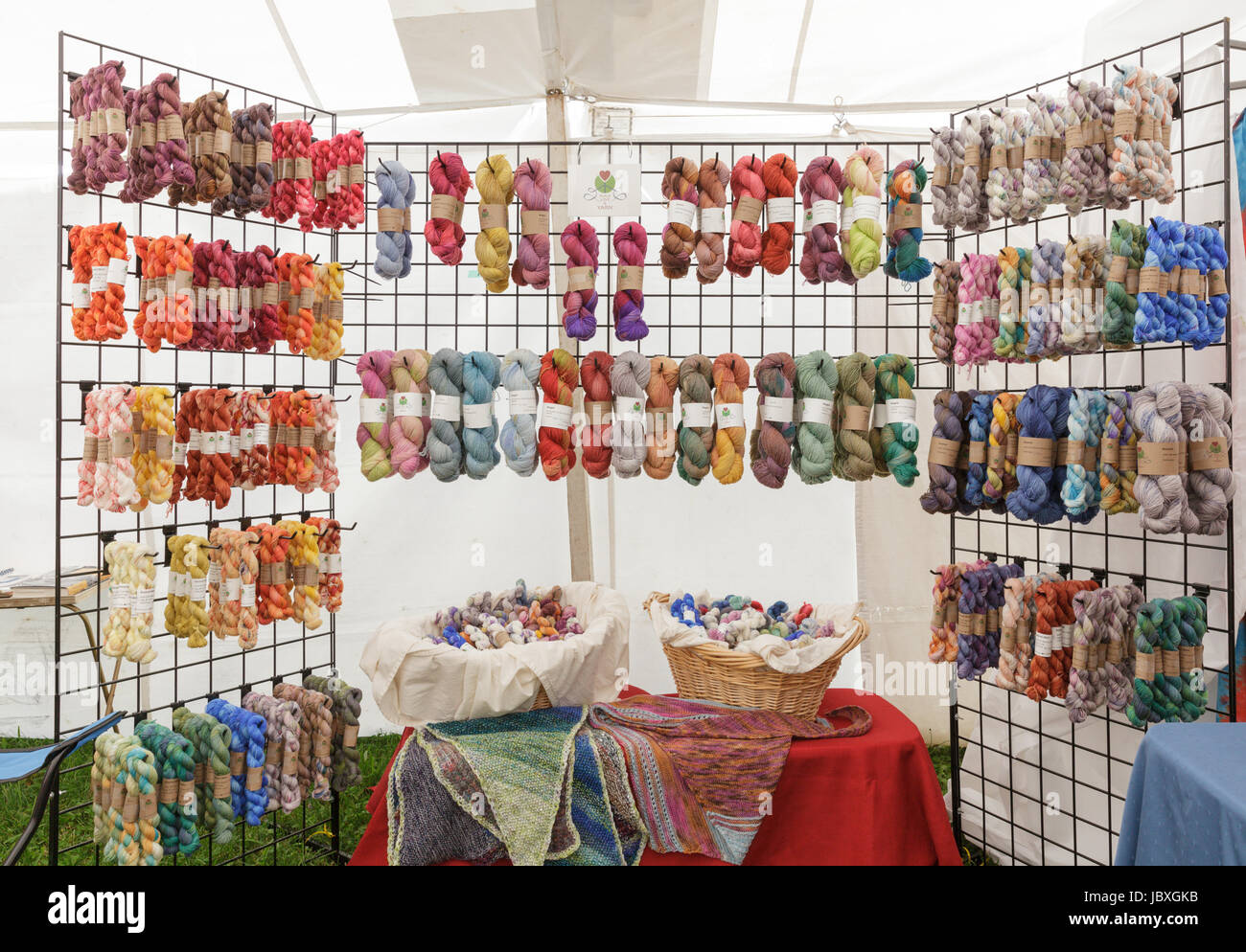 BOUCKVILLE, NY, USA - JUNE 10 2017: Many kinds of hand dyed wool skeins for sale at the annual Fiber Festival of Central New York. Stock Photo