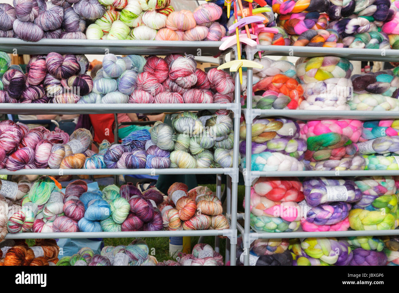 BOUCKVILLE, NY, USA - JUNE 10 2017: Merino and other types of wool skeins for sale at the annual Fiber Festival of Central New York. Stock Photo