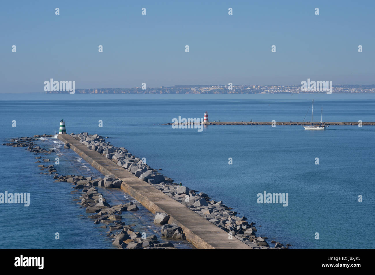 entrance to Portimao harbour in the Algarve Portugal with Lagos in the distance. Stock Photo