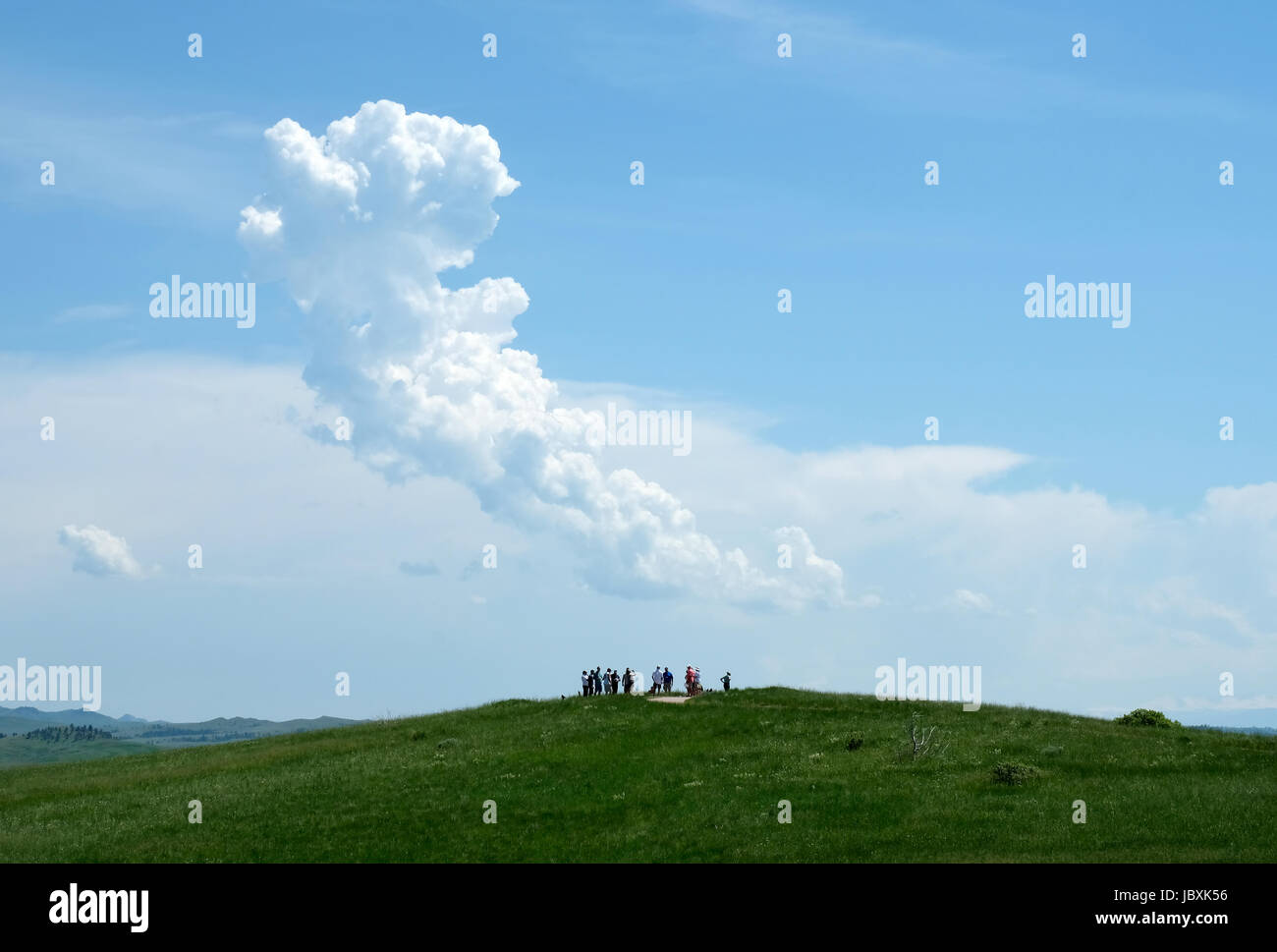 Visitors stand on a high point at the Little Bighorn battlefield site, Crow Agency, Montana, USA. Stock Photo