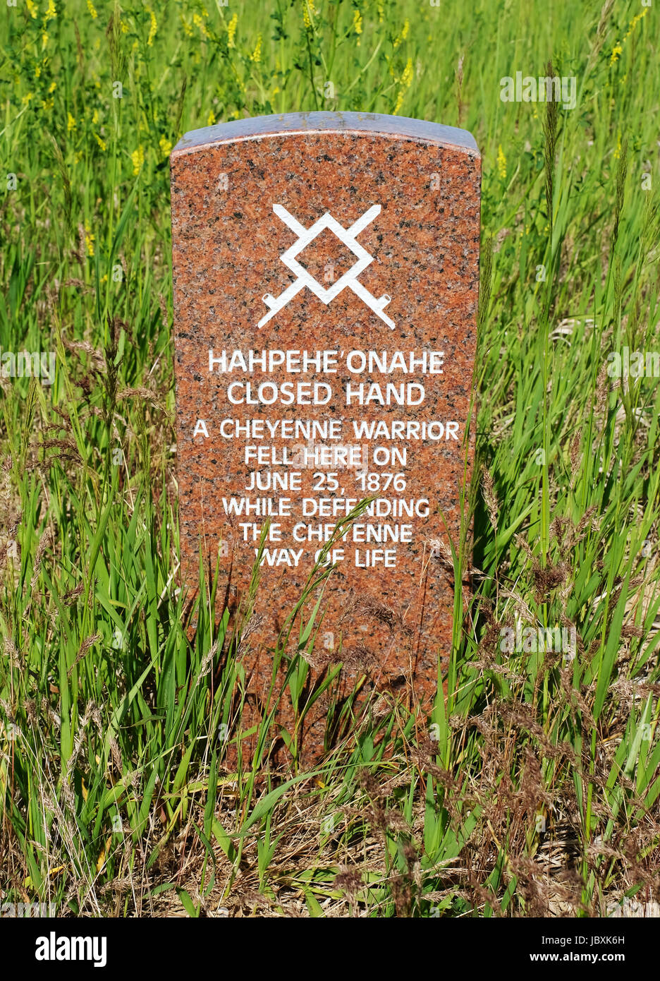 A head stone marks the spot where Cheyenne Warrior "Hahpehe Onahe" "Closed Hand" fell during the battle of Little Bighorn, Montana, in 1876. Stock Photo