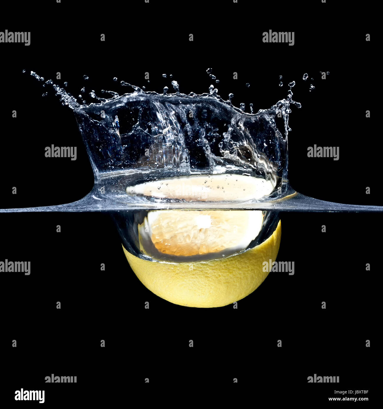 high speed photography grapefruit splash in water Stock Photo