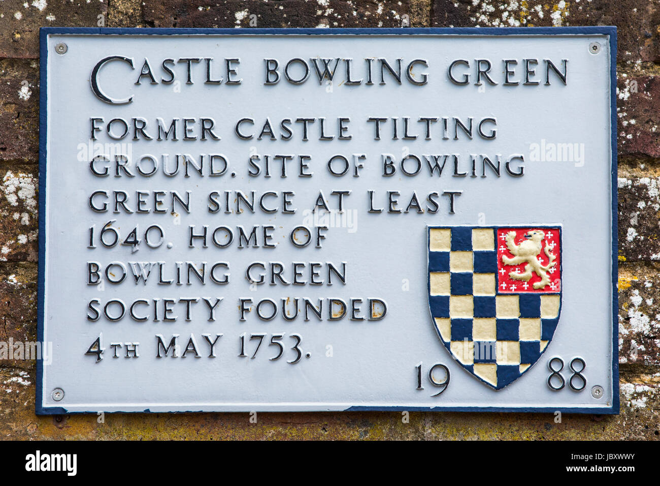 A plaque at Castle Bowling Green in Lewes, detailing the history of the landmark. Stock Photo