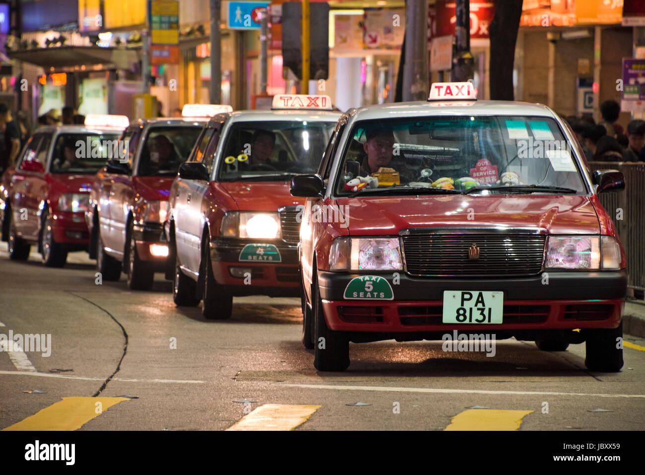 Vertical view of traditional red taxis in Hong Kong, China. Stock Photo