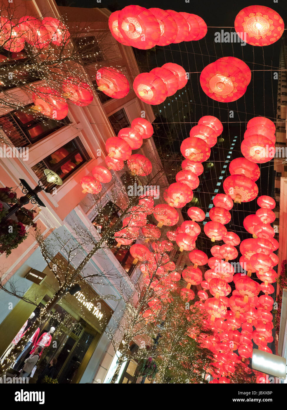 Vertical view of Chinese New Year decorations lit up at night at the controversial Lee Tung Street urban renewal development in Hong Kong, China. Stock Photo