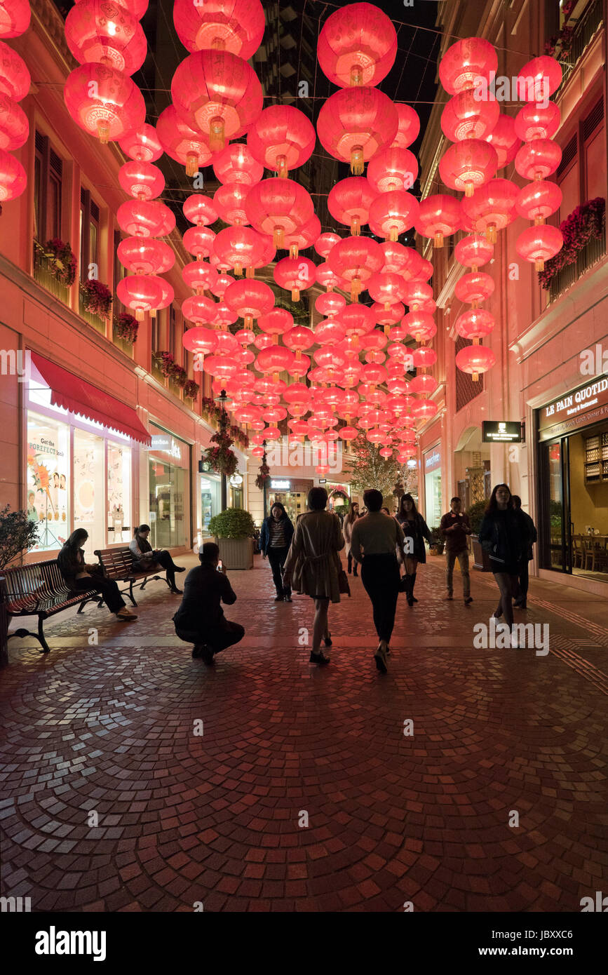 Vertical view of Chinese New Year decorations lit up at night at the controversial Lee Tung Street urban renewal development in Hong Kong, China. Stock Photo