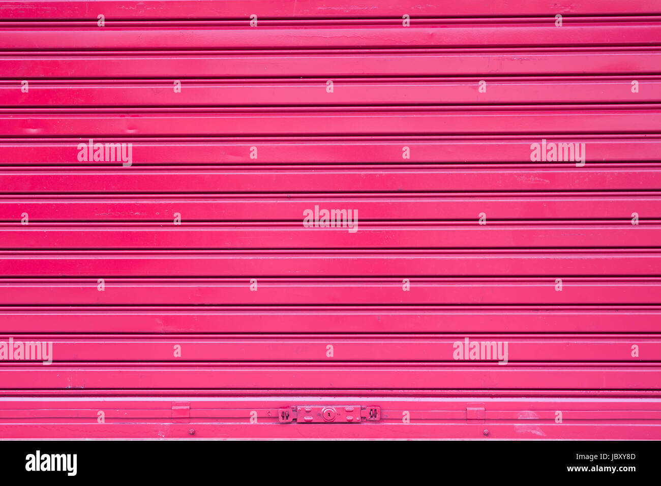Red roller metal door surface of apartment Stock Photo Alamy