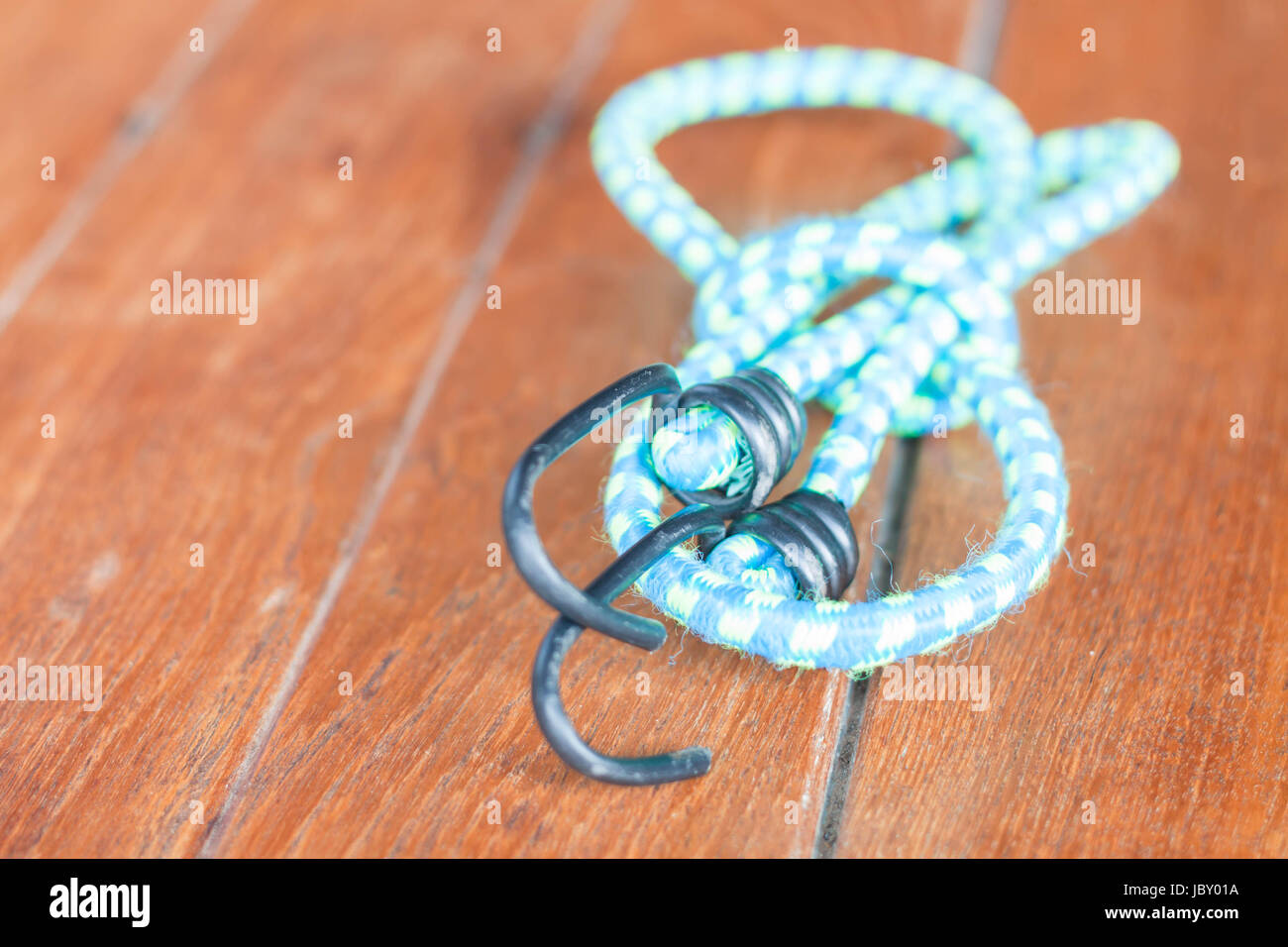 Light blue elastic rope with metal hooks Stock Photo Alamy