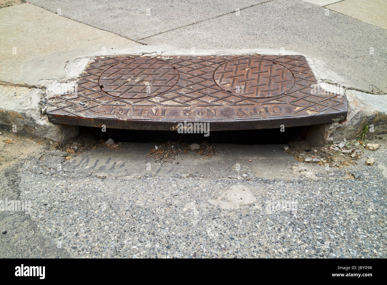 us city street corner kerb storm drain Philadelphia USA Stock Photo
