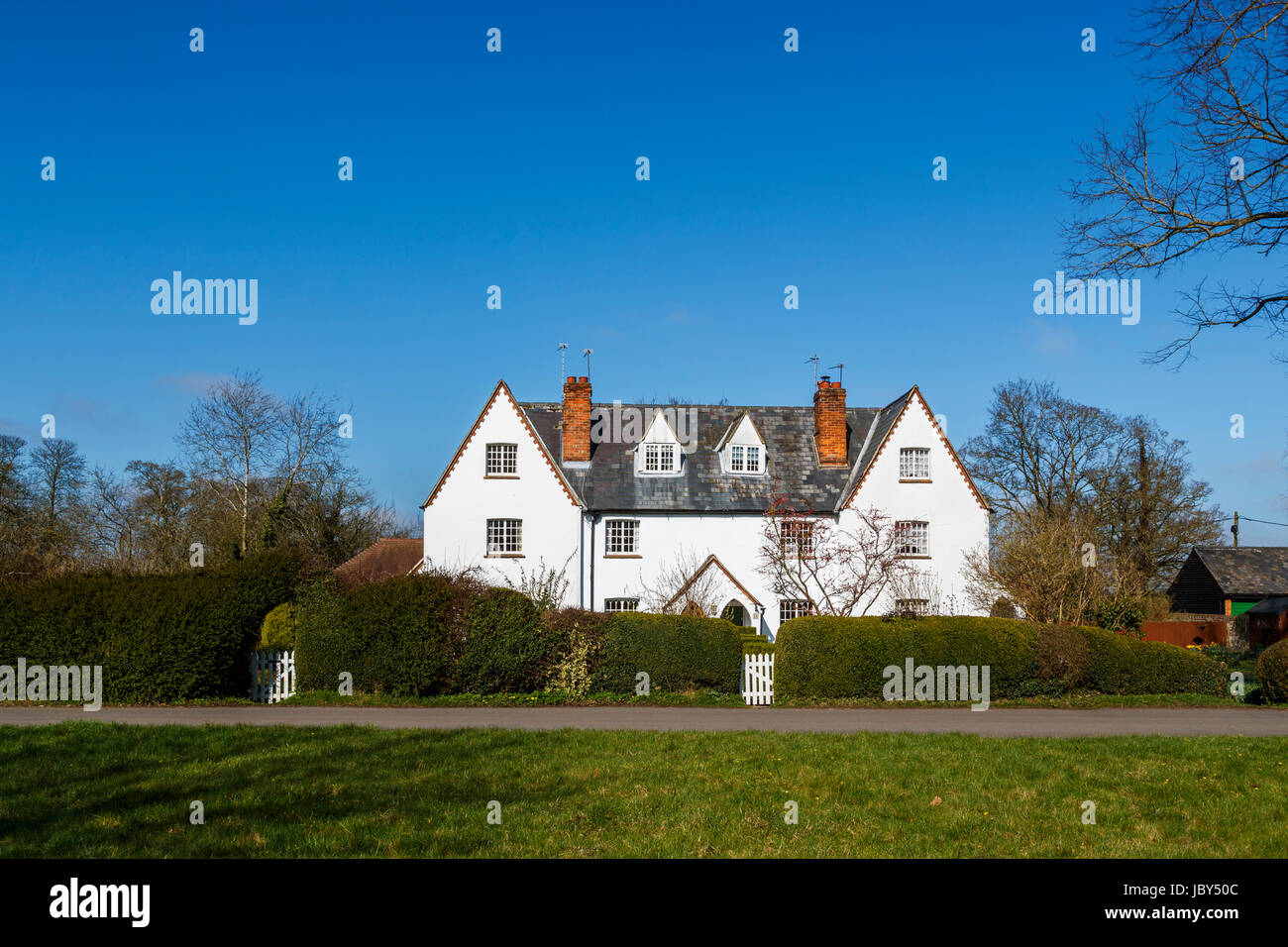 Real estate Typical attractive white cottage property with slate roof