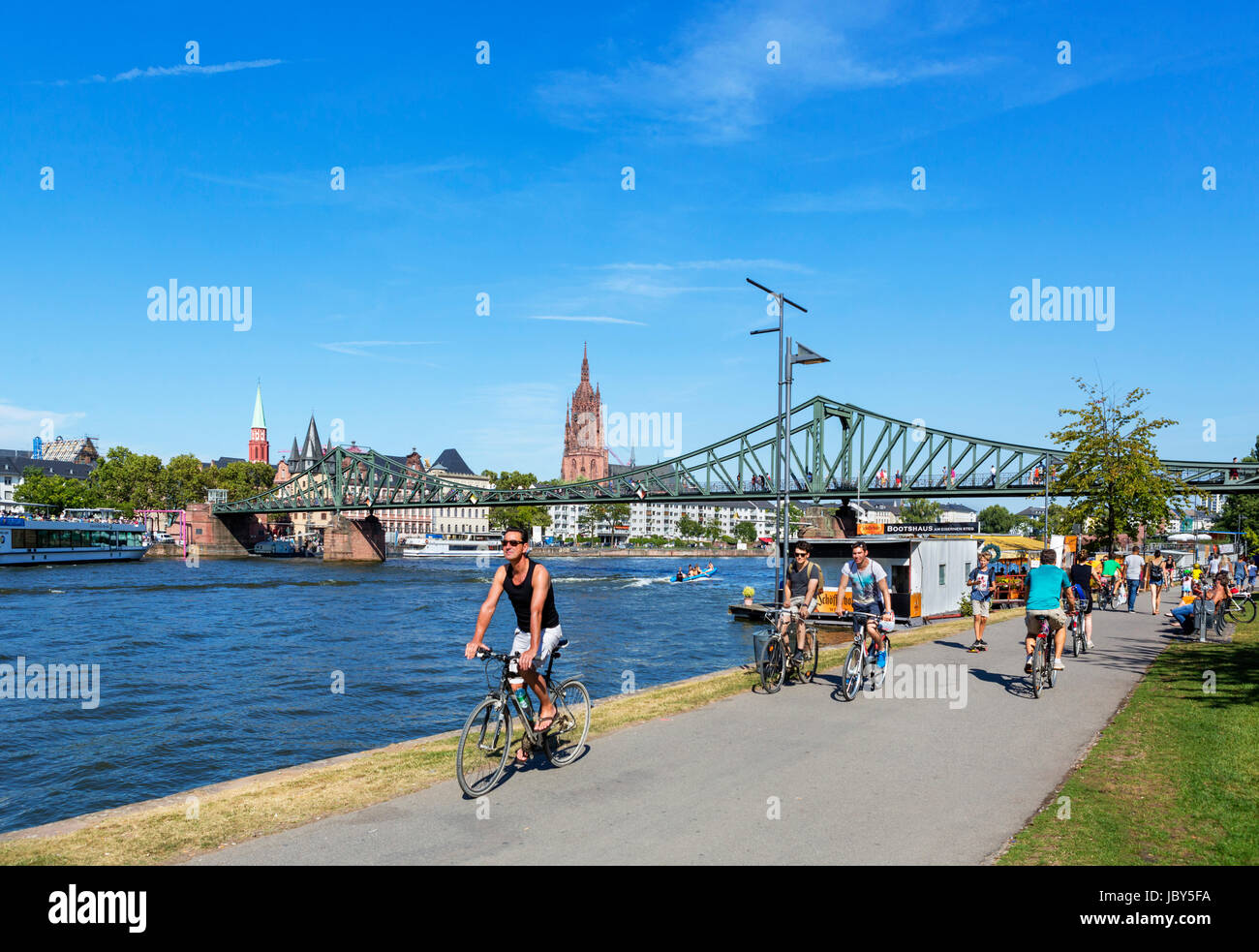 View towards Frankfurt Cathedral (Frankfurter Dom) and the Eiserner Steg from the banks of the River Main, Frankfurt, Hesse, Germany Stock Photo