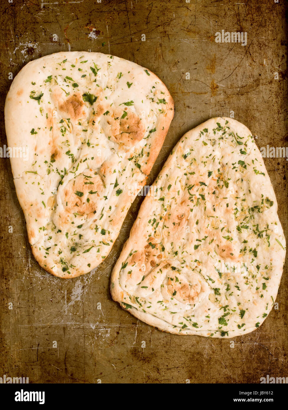 close up of rustic indian garlic and cilantro naan bread Stock Photo