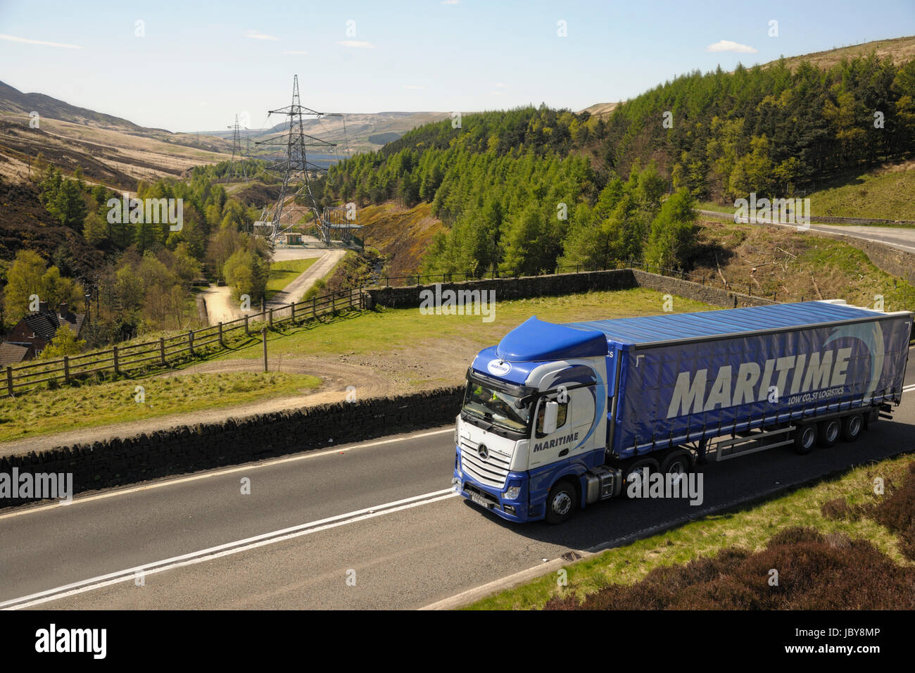 Maritime Group Mercedes-Benz Actros curtainsider truck climbs Woodhead Pass in Yorkshire, UK Stock Photo