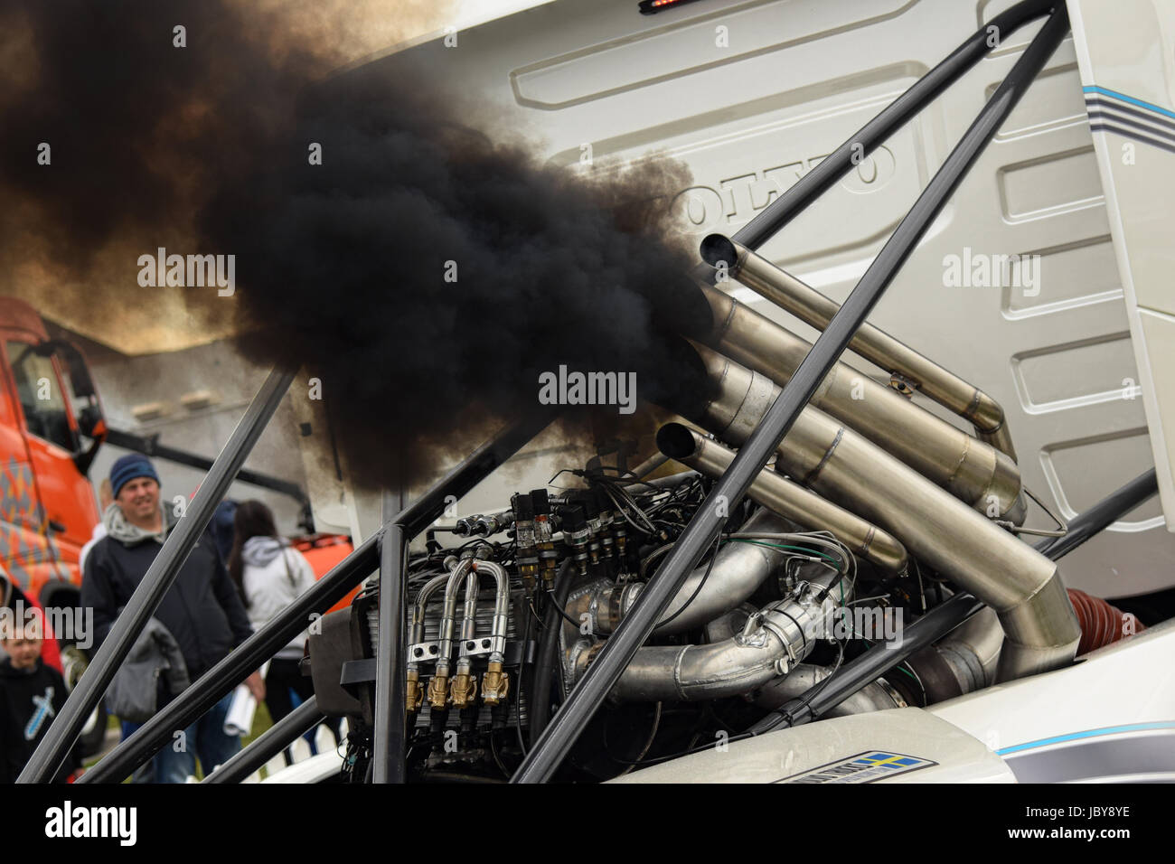 Black smoke belching out ad the Volvo Iron Knight racing truck engine starts up Stock Photo