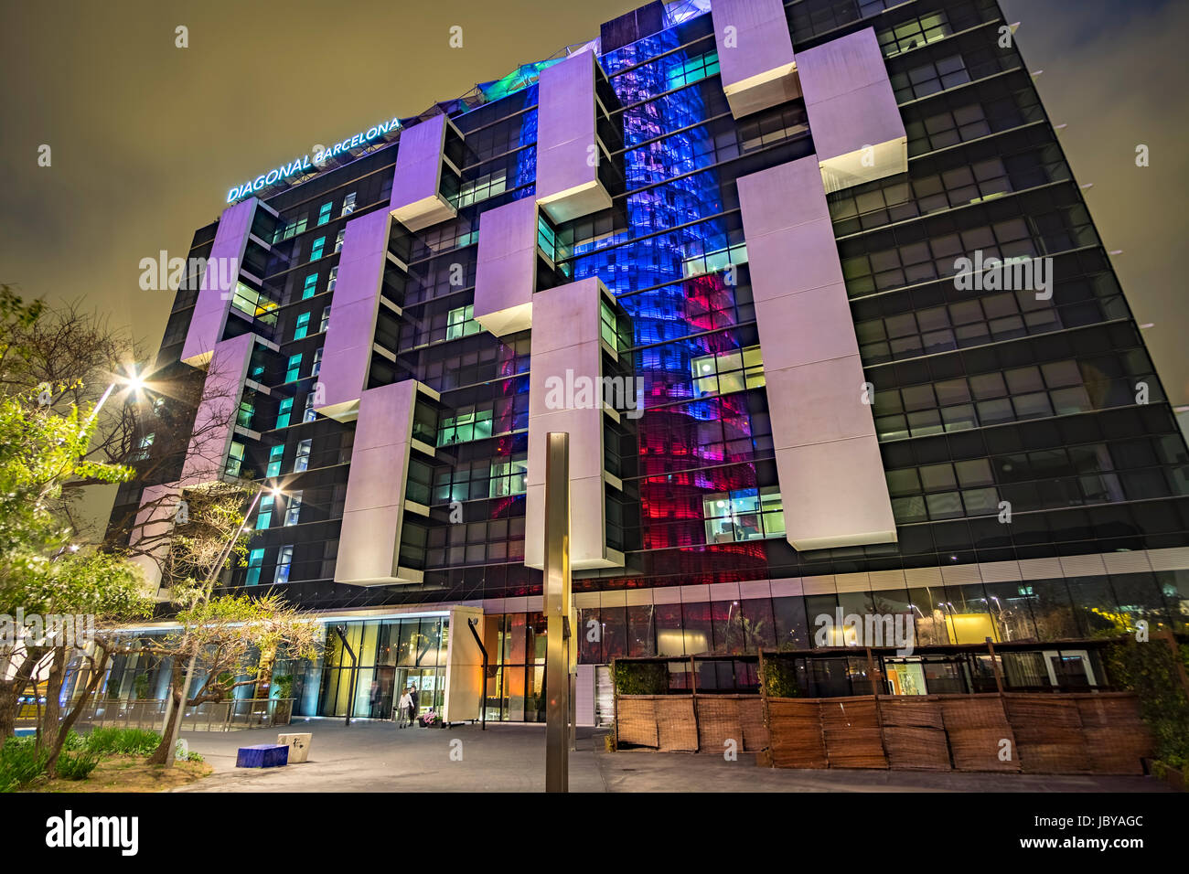 The Torre Agbar tower reflected in the Diagonal building in Barcelona, Spain Stock Photo