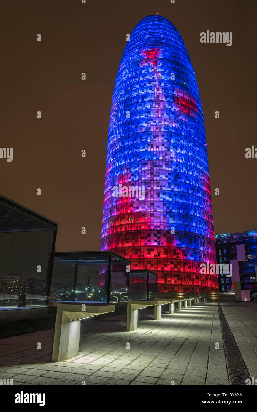 Close up of The Torre Agbar , Barcelona, lite up at night in stunning colours. Stock Photo