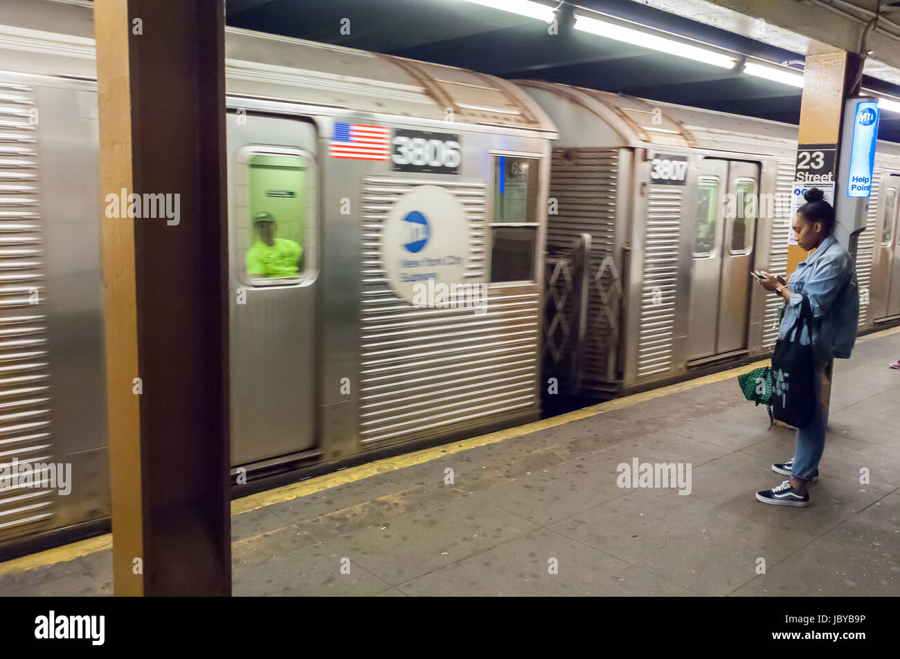 A 'C' train on the IND line arrives at the 23rd Street station in the subway in New York on Tuesday, June 6, 2017. The 'C' line R32 cars, known as 'Brightliners' , introduced over 50 years ago, are the oldest subway cars in the system breaking down more causing disruptions in commuter travel. Replacement cars are behind schedule and over budget due to production problems. (© Richard B. Levine) Stock Photo
