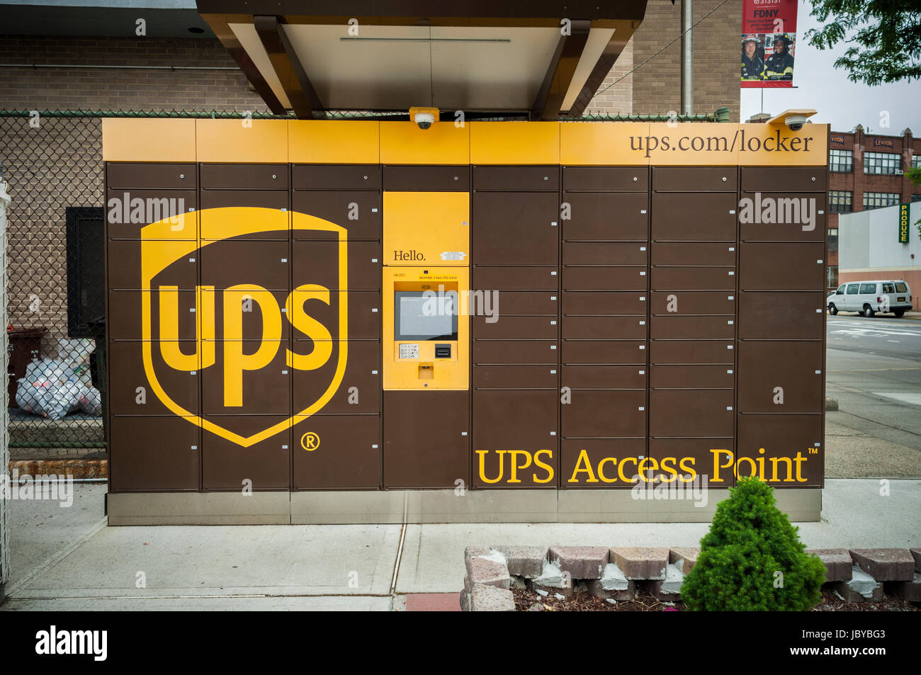 A UPS Access Point pick-up station in outside of a gas station in the Greenpoint neighborhood of New York on Sunday, June 4, 2017. The lockers enable customers, who work and do not have doorman or another party, to receive their purchase in a secure location. Amazon has had a similar network of lockers for several years. (© Richard B. Levine) Stock Photo