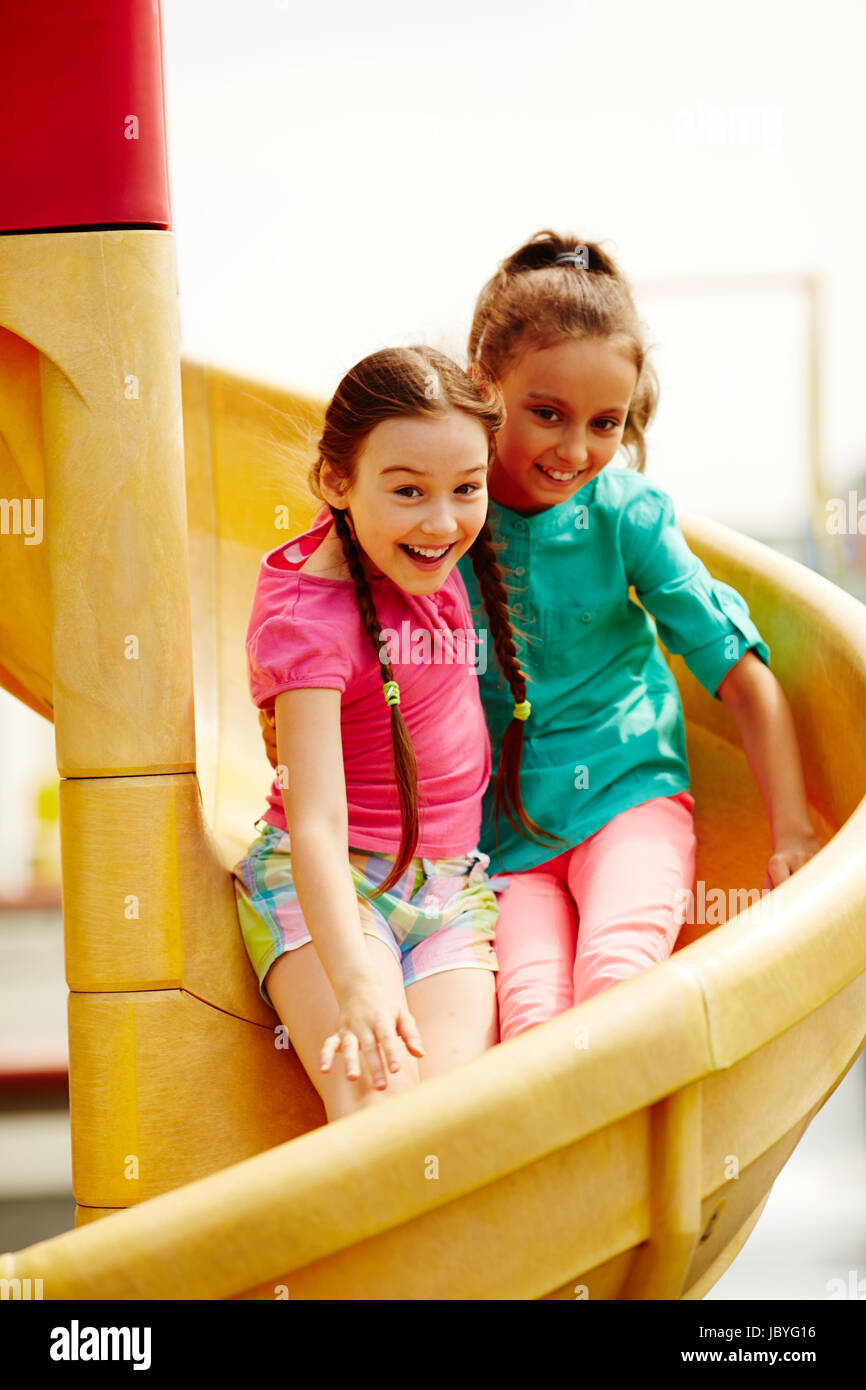 Image of cute girls having fun on playground Stock Photo - Alamy