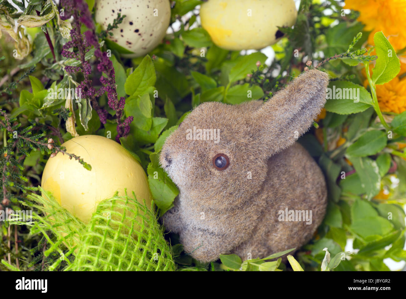 Easter eggs and Easter bunny with flowers Stock Photo - Alamy