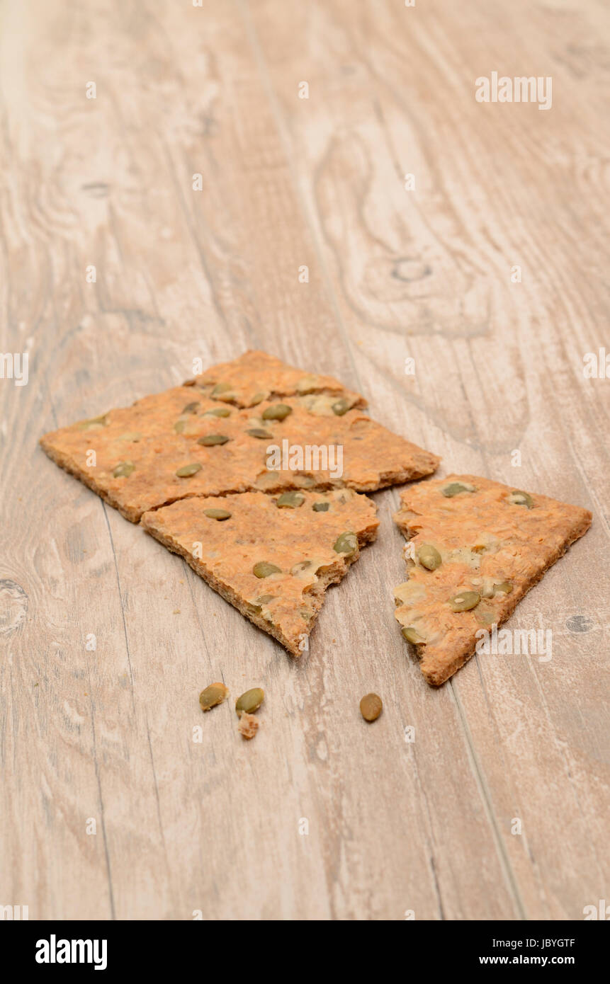 Whole grain bread on a wooden table Stock Photo - Alamy
