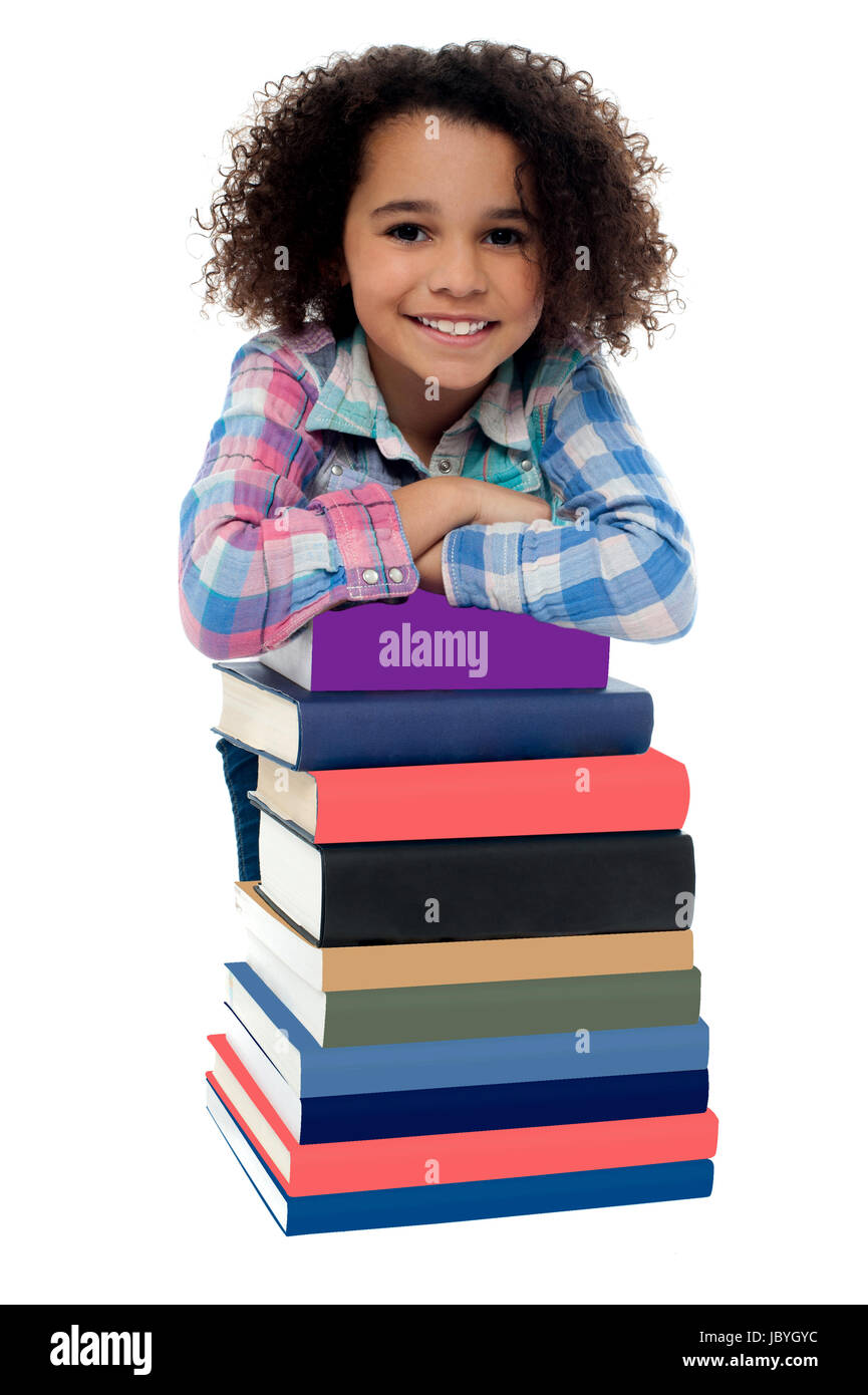 Happy girl with stack of textbooks Stock Photo - Alamy