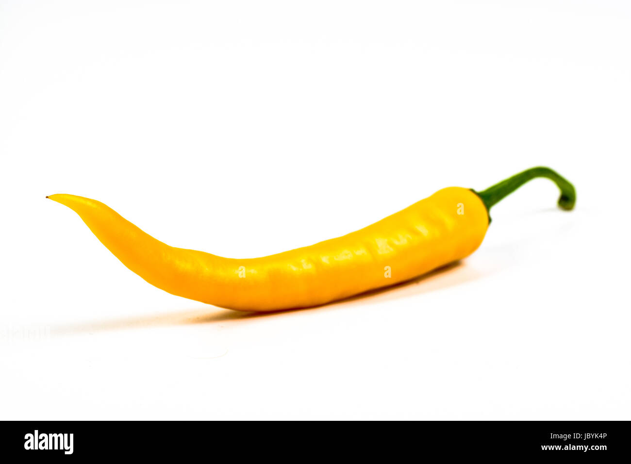 yellow hot chili pepper on a white background Stock Photo - Alamy